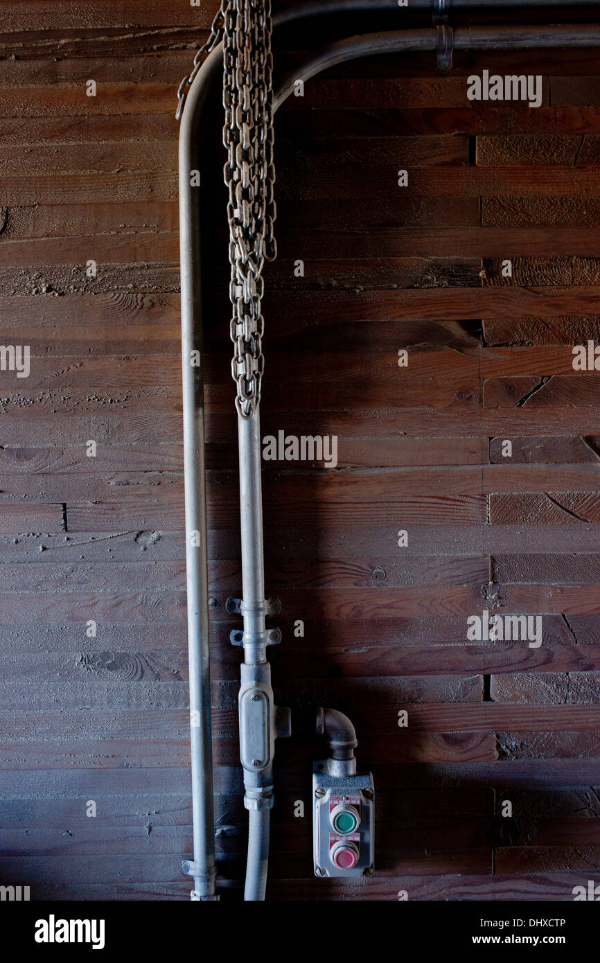 Power Switches and Electrical Pipes in Barn Stock Photo