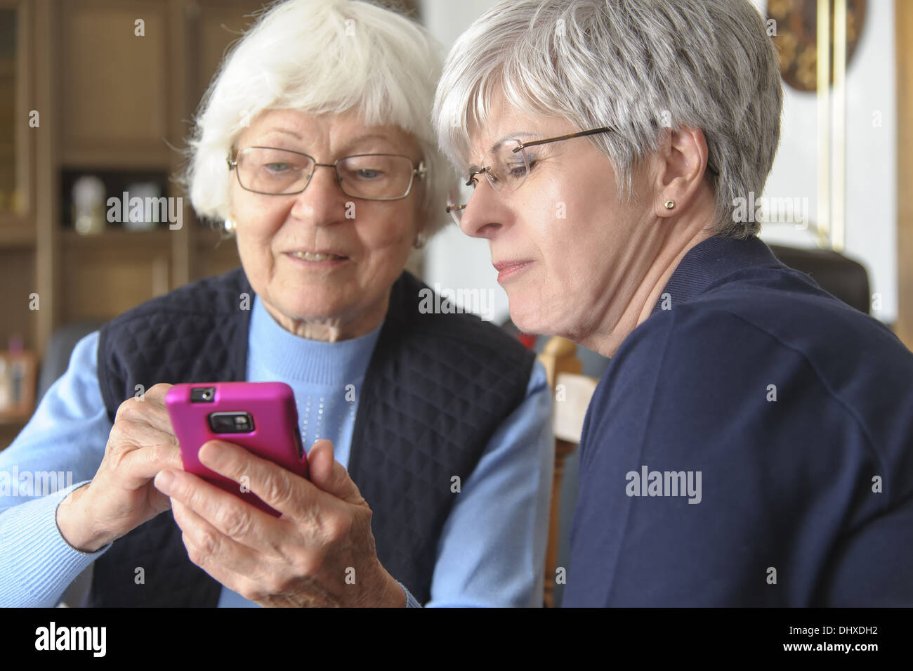 Two seniors with a smartphone Stock Photo