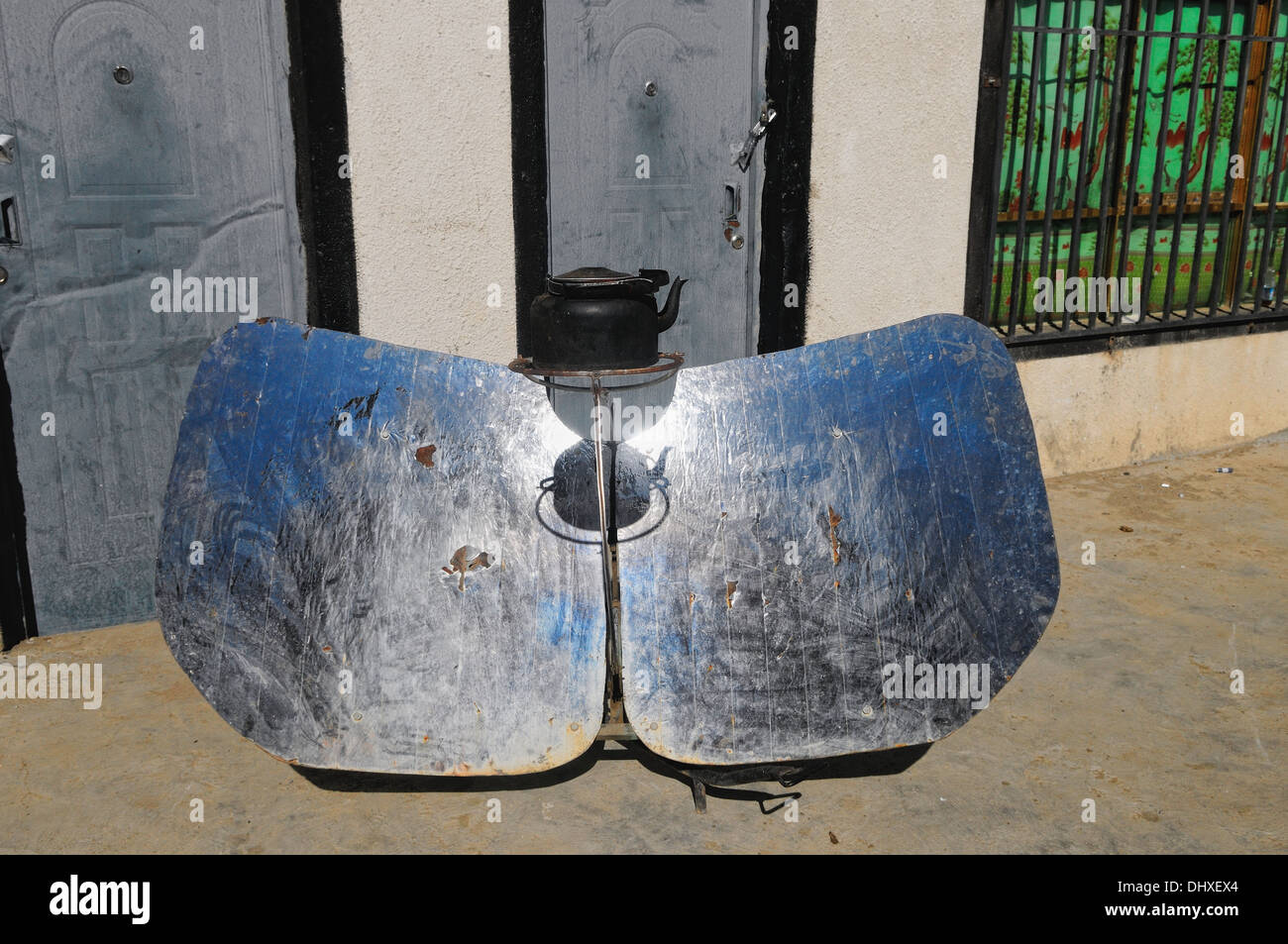 Solar cooker with water jug Stock Photo