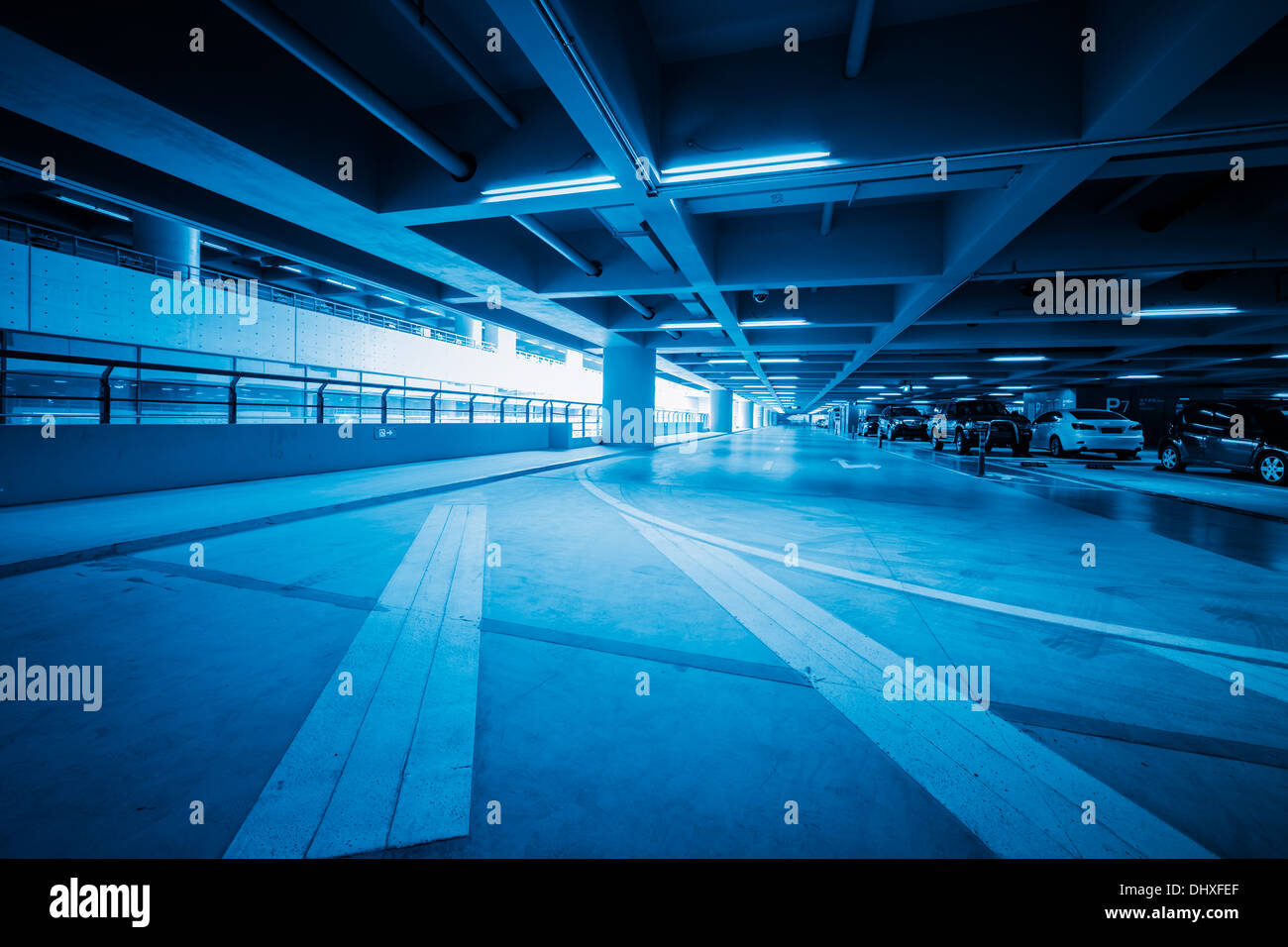 Traffic In Car Park With Blue Toned Stock Photo - Alamy