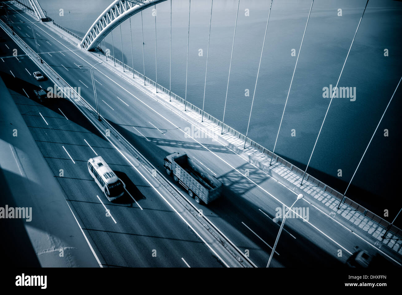ighway and modern bridge of a city,blue toned. Stock Photo