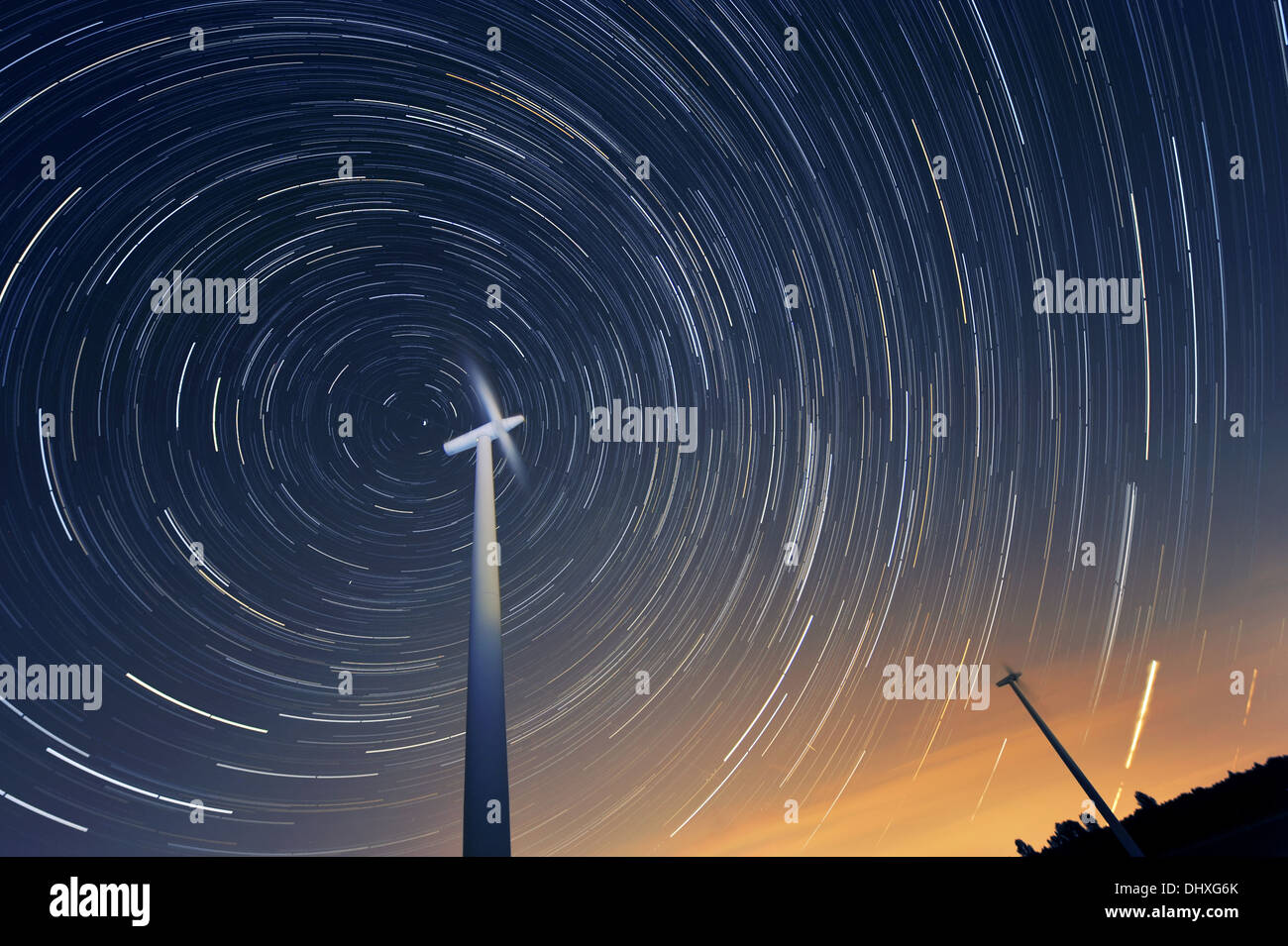 Wind turbines against the night sky Stock Photo