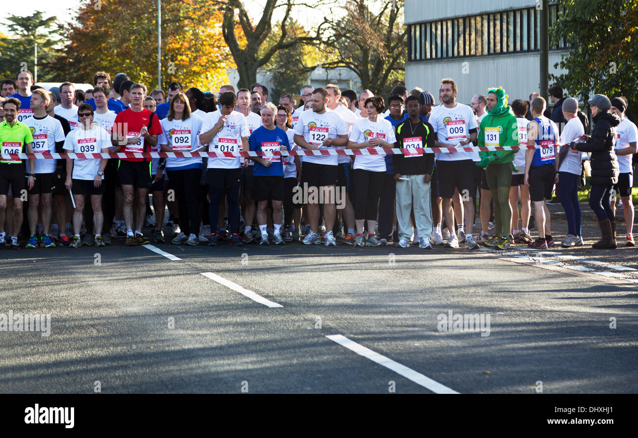 Runners at the starting line getting ready to begin the race at the Cambridge Fun Run in aid of BBC Children in Need 15th November 2013 Cambridge, England Stock Photo