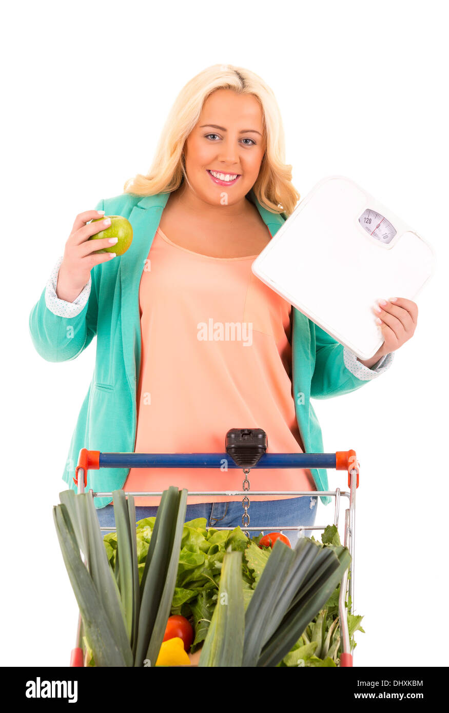 Large woman at the supermarket in search for healthy food - diet concept Stock Photo