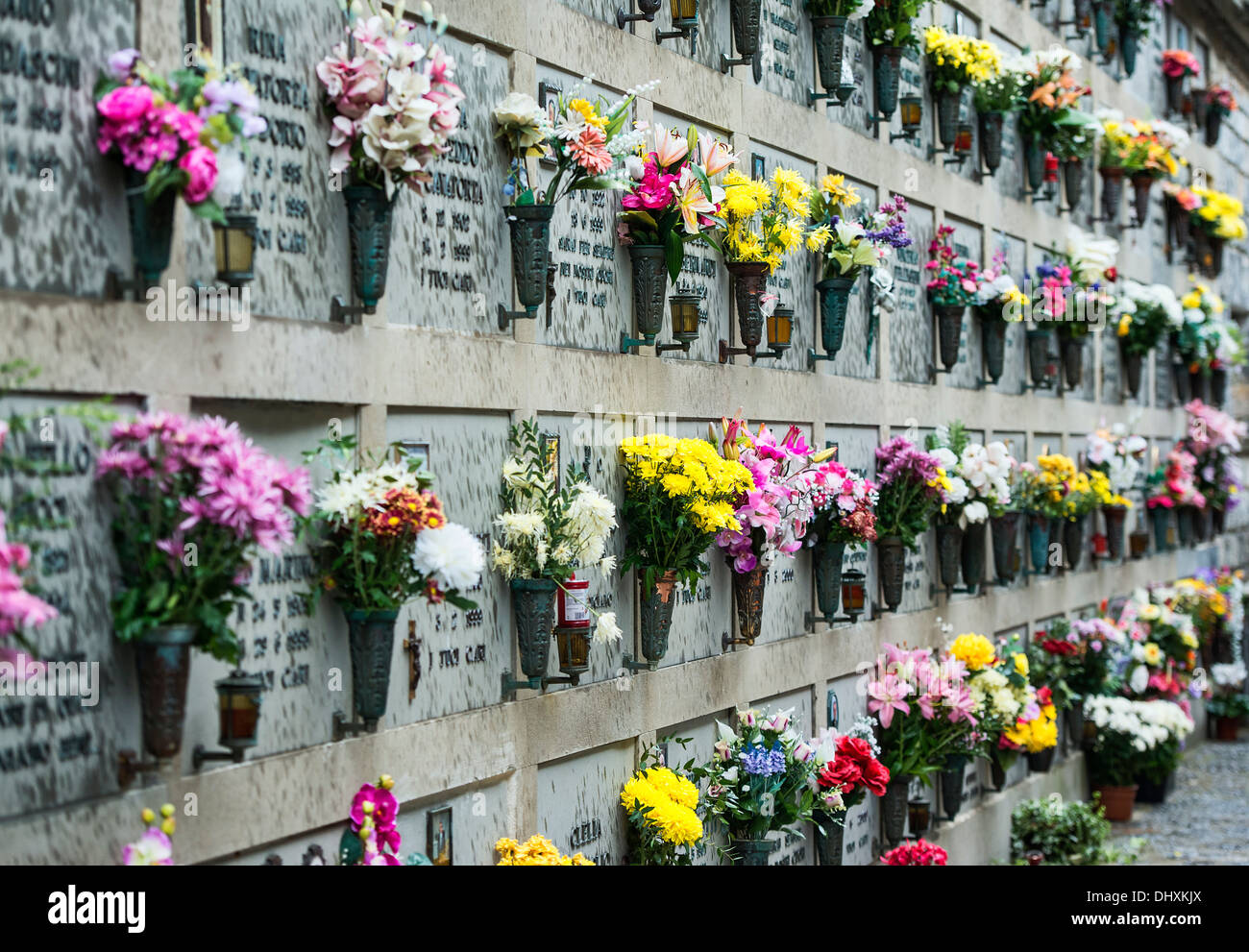 Fresh flowers adorn the burial vaults of the village cemetery, Porto Venere, Italy Stock Photo