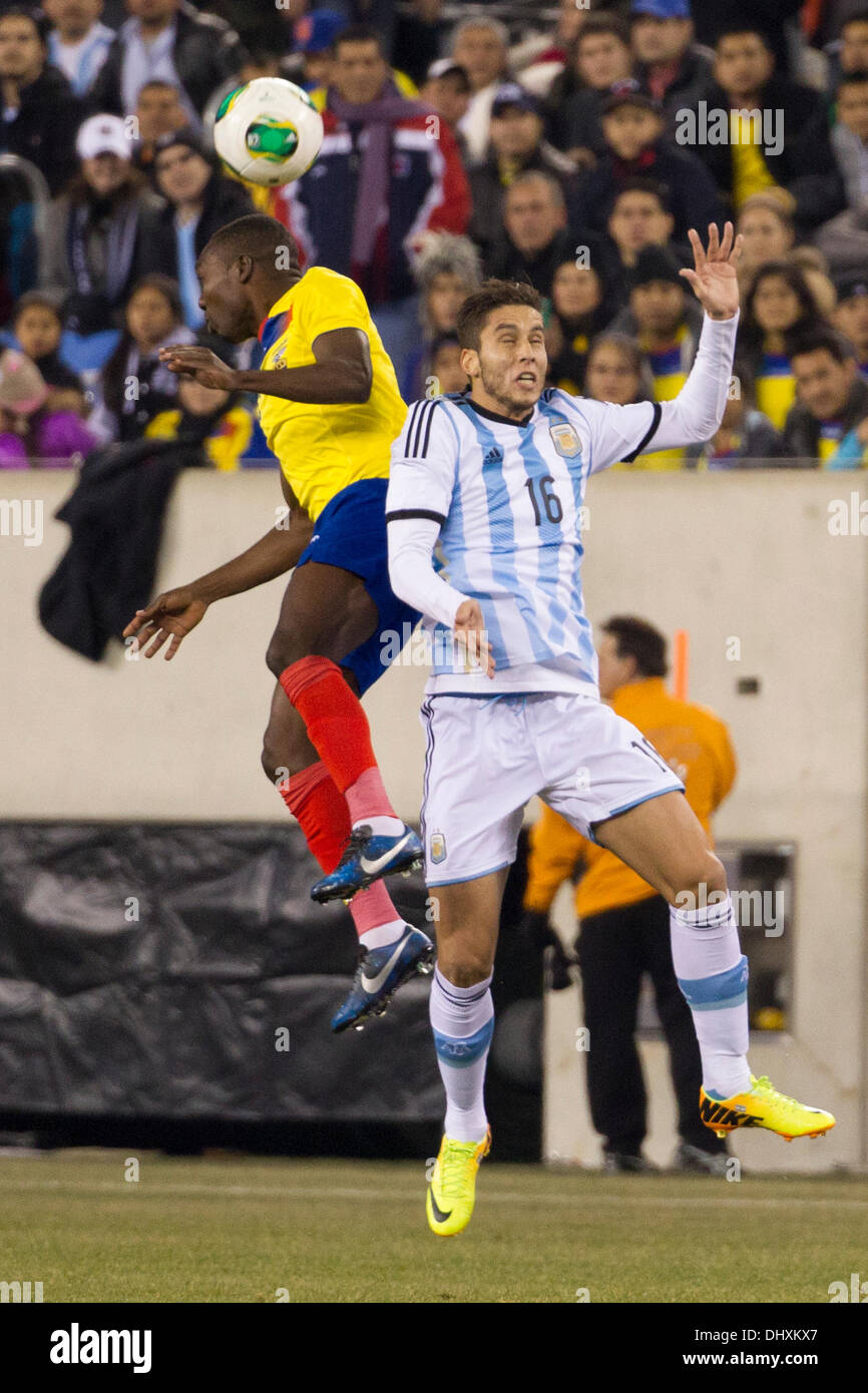 a tie, 0-0, . 15th Nov, 2013. Ecuador midfielder Walter Ayovi (10) heads the ball with Argentina midfielder Richardo Alvarez (16) by him during the Gillette International Soccer series game between Argentina and Ecuador at the MetLife Stadium in East Rutherford, New Jersey. The match ends in a tie, 0-0. (Christopher Szagola/Cal Sport Media) © csm/Alamy Live News Stock Photo
