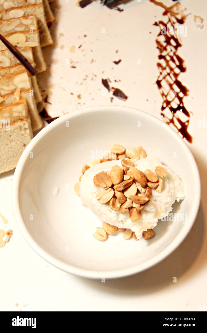 Closeup Coconut ice cream in a white cup. Stock Photo