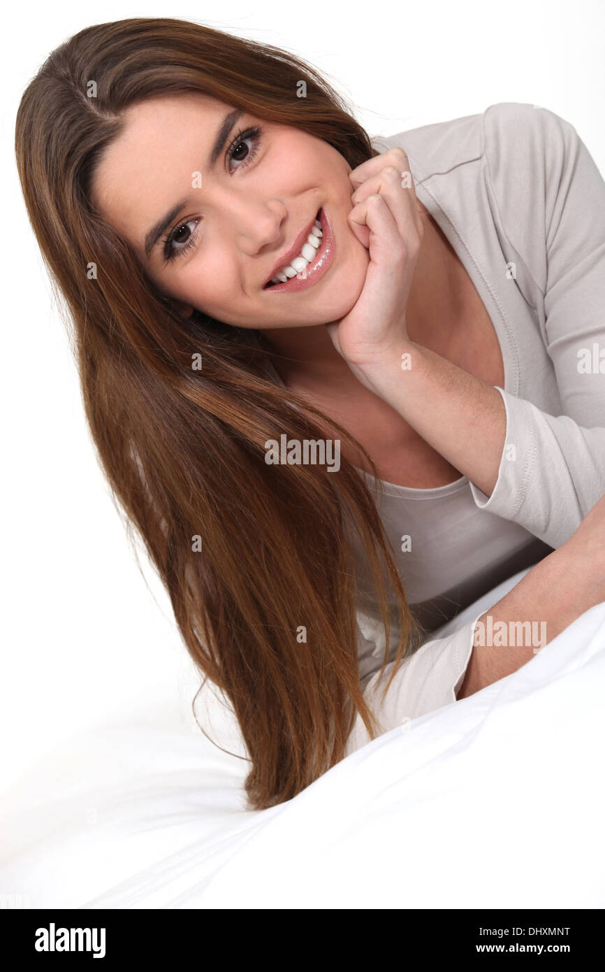 Woman laid on bed relaxing hi-res stock photography and images - Alamy