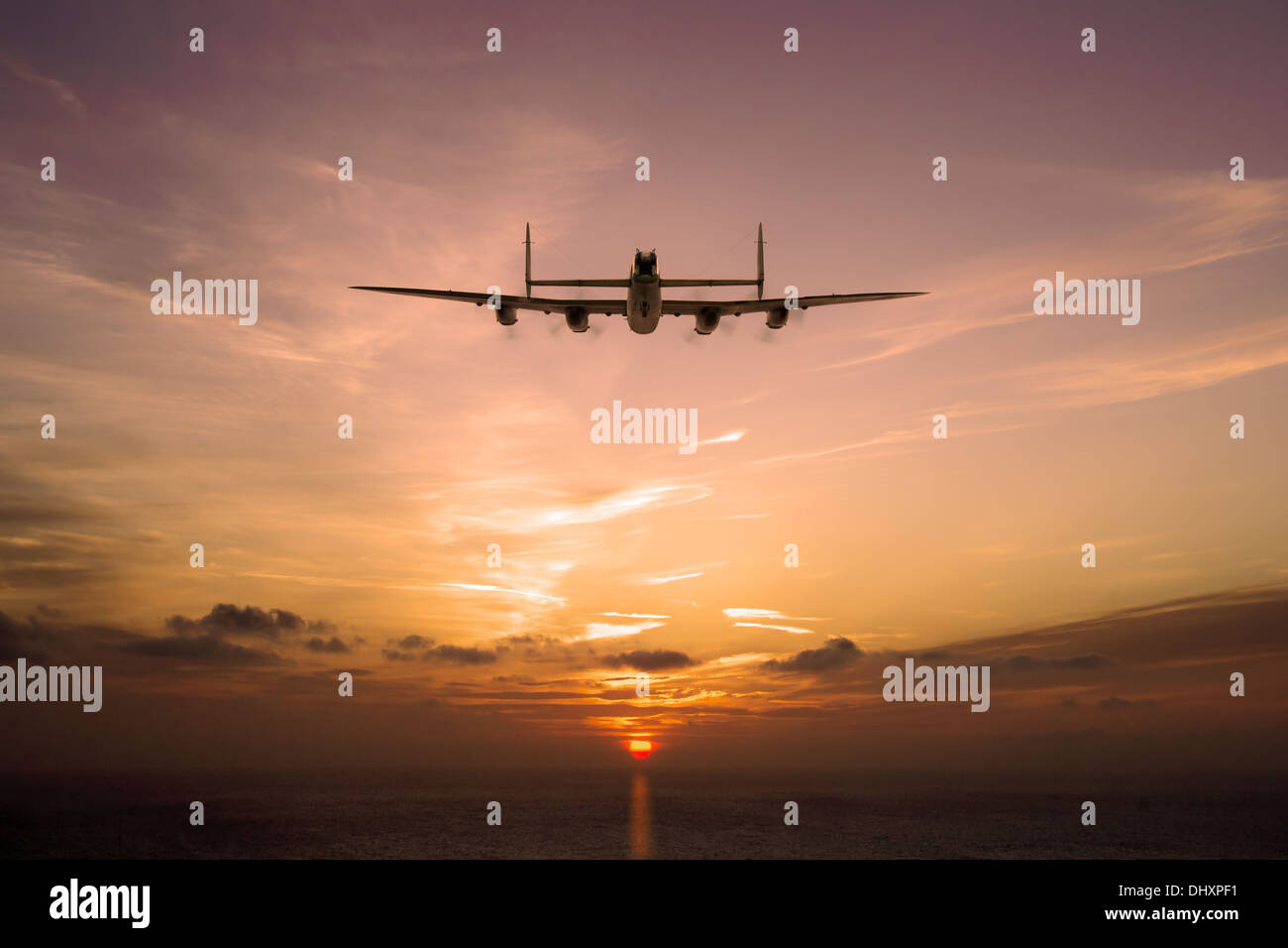 A solitary Avro Lancaster heads into the low sun. Another long night is ending or day is beginning. Stock Photo