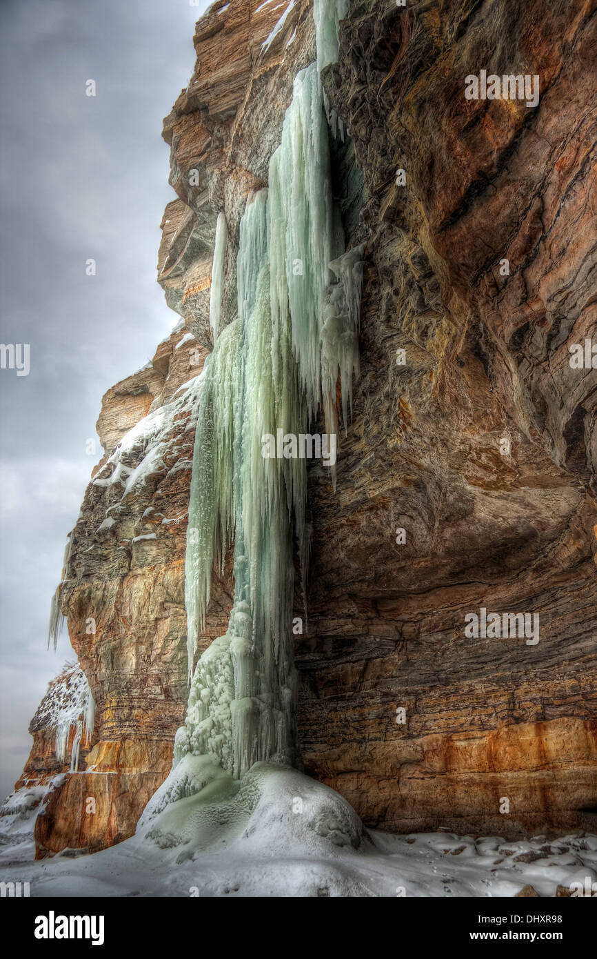 An hdr (high dynamic range) photo of extremely long icicles on a cliff
