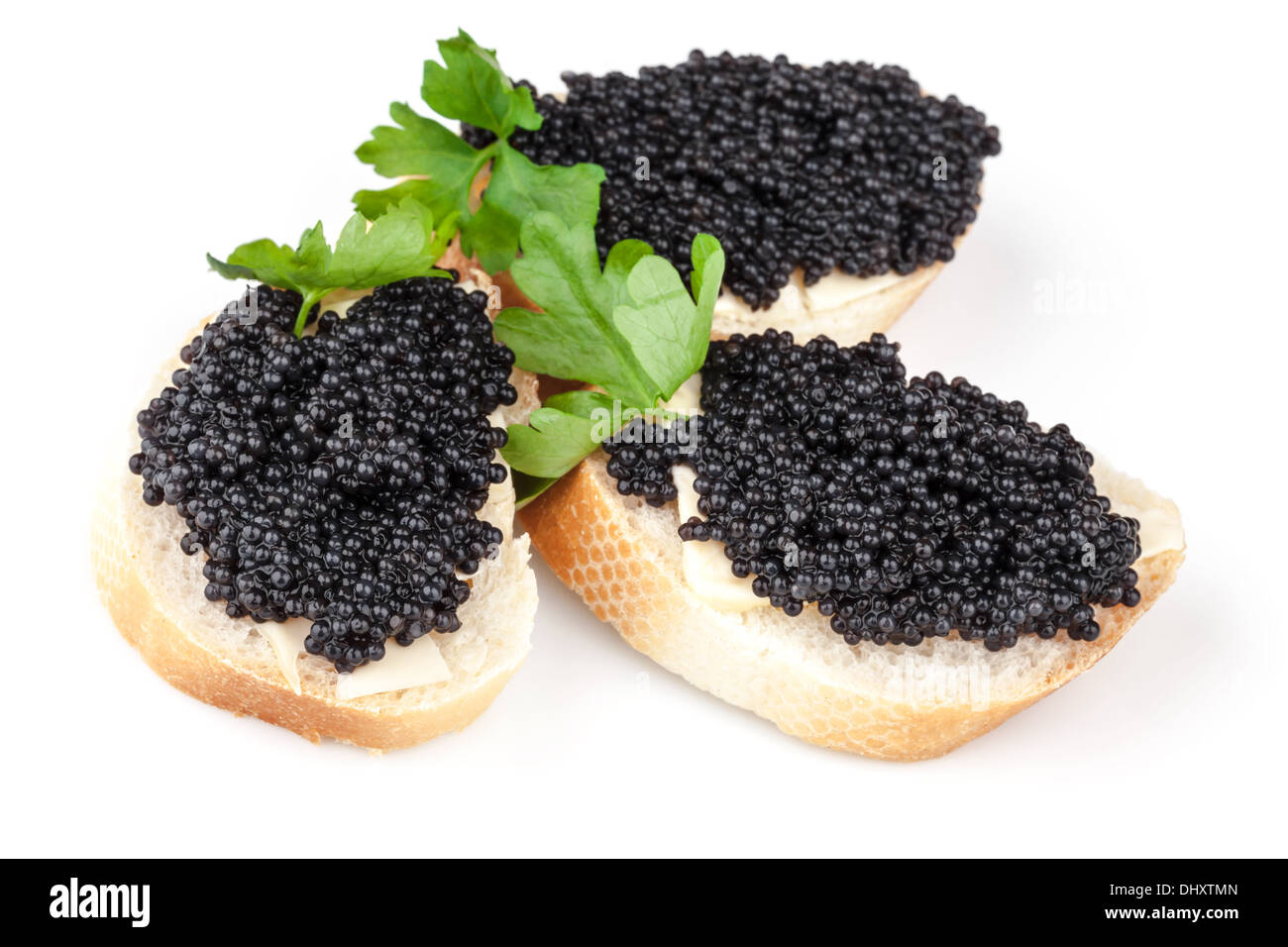 Three sandwiches with black caviar isolated on white background Stock Photo