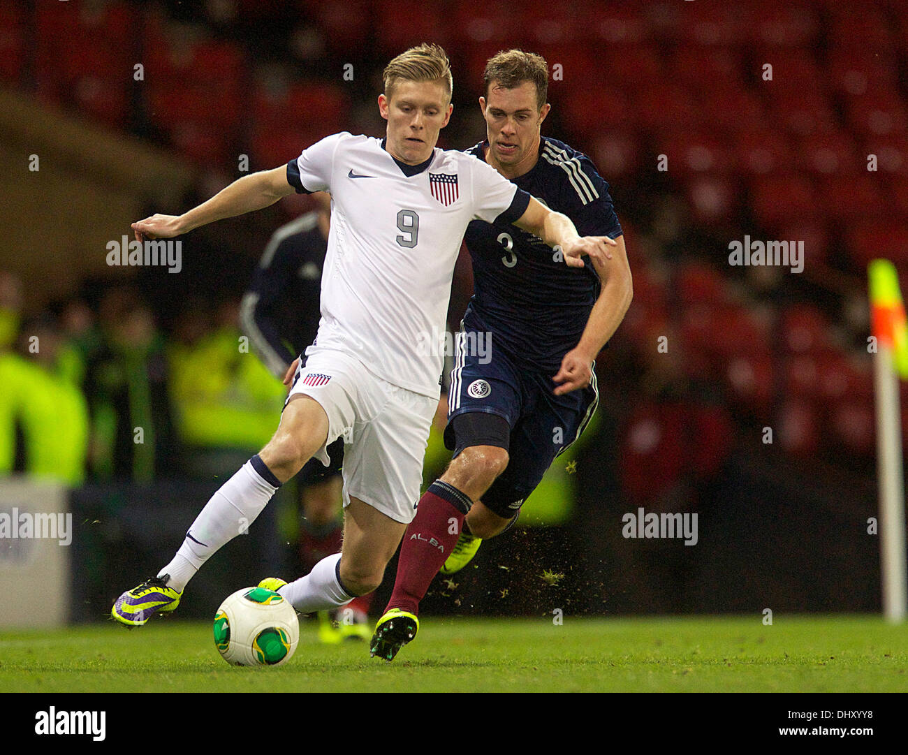 Glasgow, Scotland. 15th Nov, 2013. USA's Aron Johannsson holds off Scotland's Steven Whittaker during the International friendly fixture between Scotland and the USA. From Hampden Stadium, Glasgow. Credit:  Action Plus Sports/Alamy Live News Stock Photo
