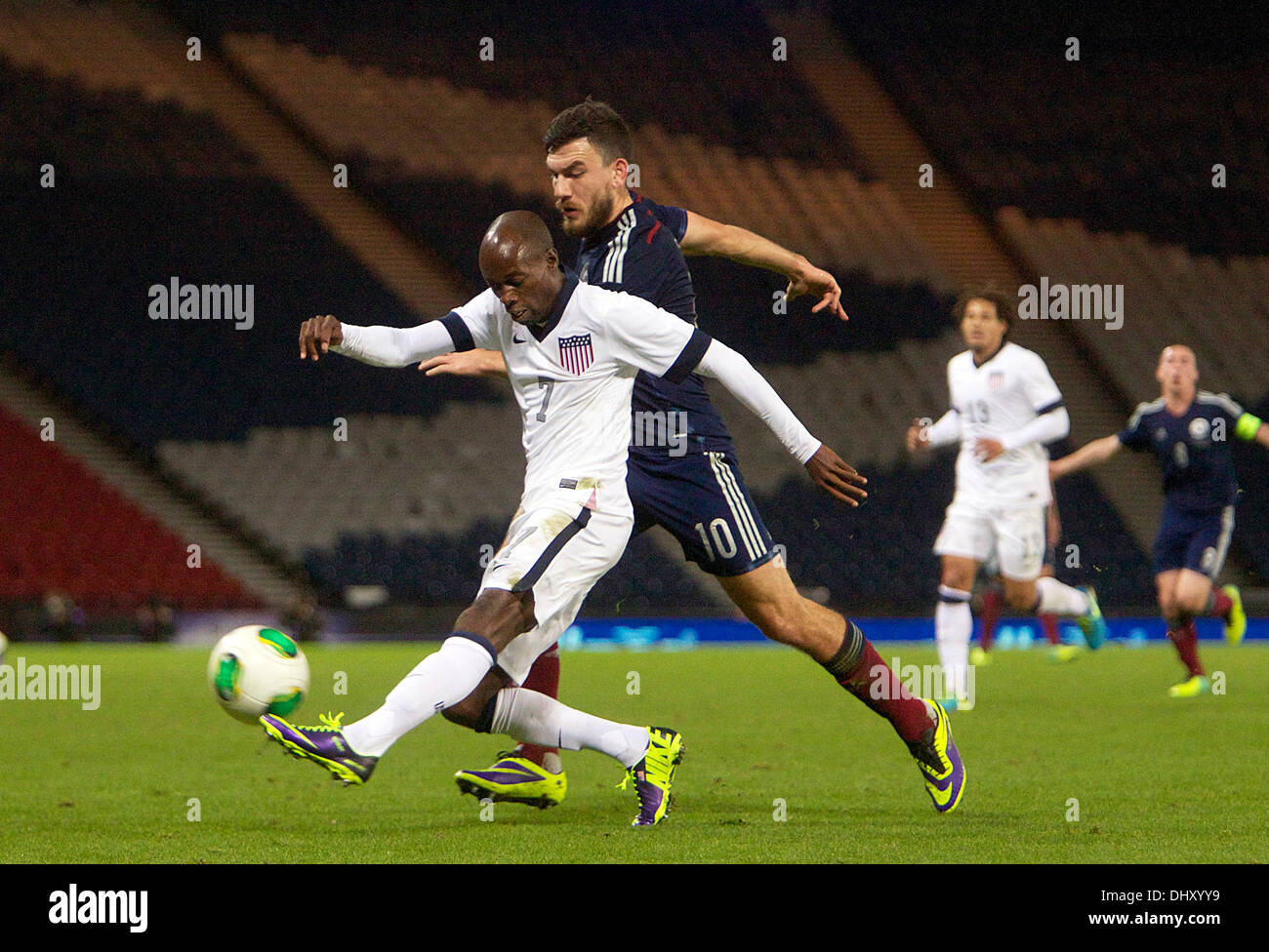 Glasgow, Scotland. 15th Nov, 2013. USA's DaMarcus Beasley shields the ball from Scotland's Robert Snodgrass during the International friendly fixture between Scotland and the USA. From Hampden Stadium, Glasgow. Credit:  Action Plus Sports/Alamy Live News Stock Photo