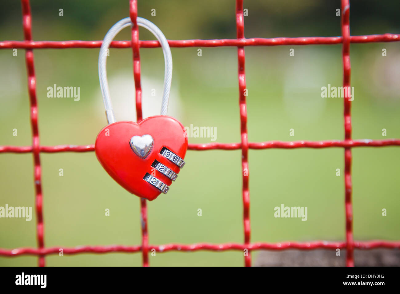 Red padlock Heart Shape on the Fence Stock Photo - Alamy