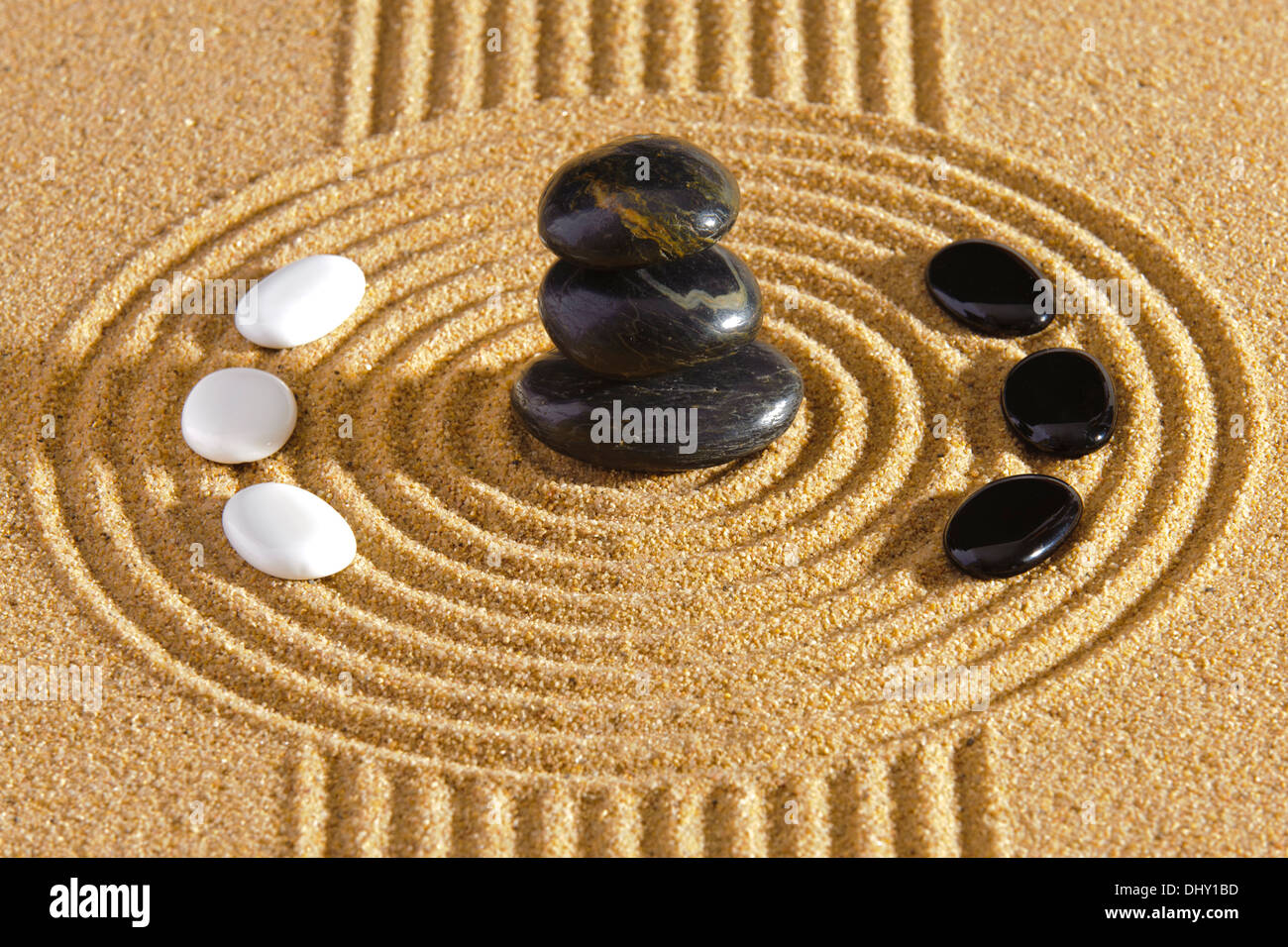 Japanese ZEN garden with stacked stones of yin and yang in raked sand Stock Photo