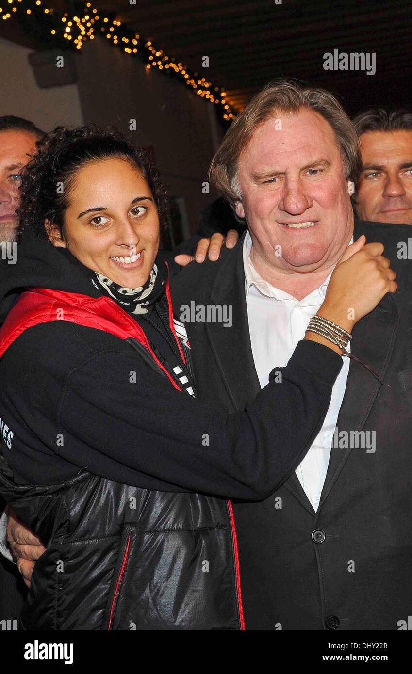 Gerard Depardieu and his daughter Roxanne (21) pose at the opening of the  traditional Christmas market on Aiderbichl, the animal paradise for  homeless animals on 14 November 2013 in the village Henndorf