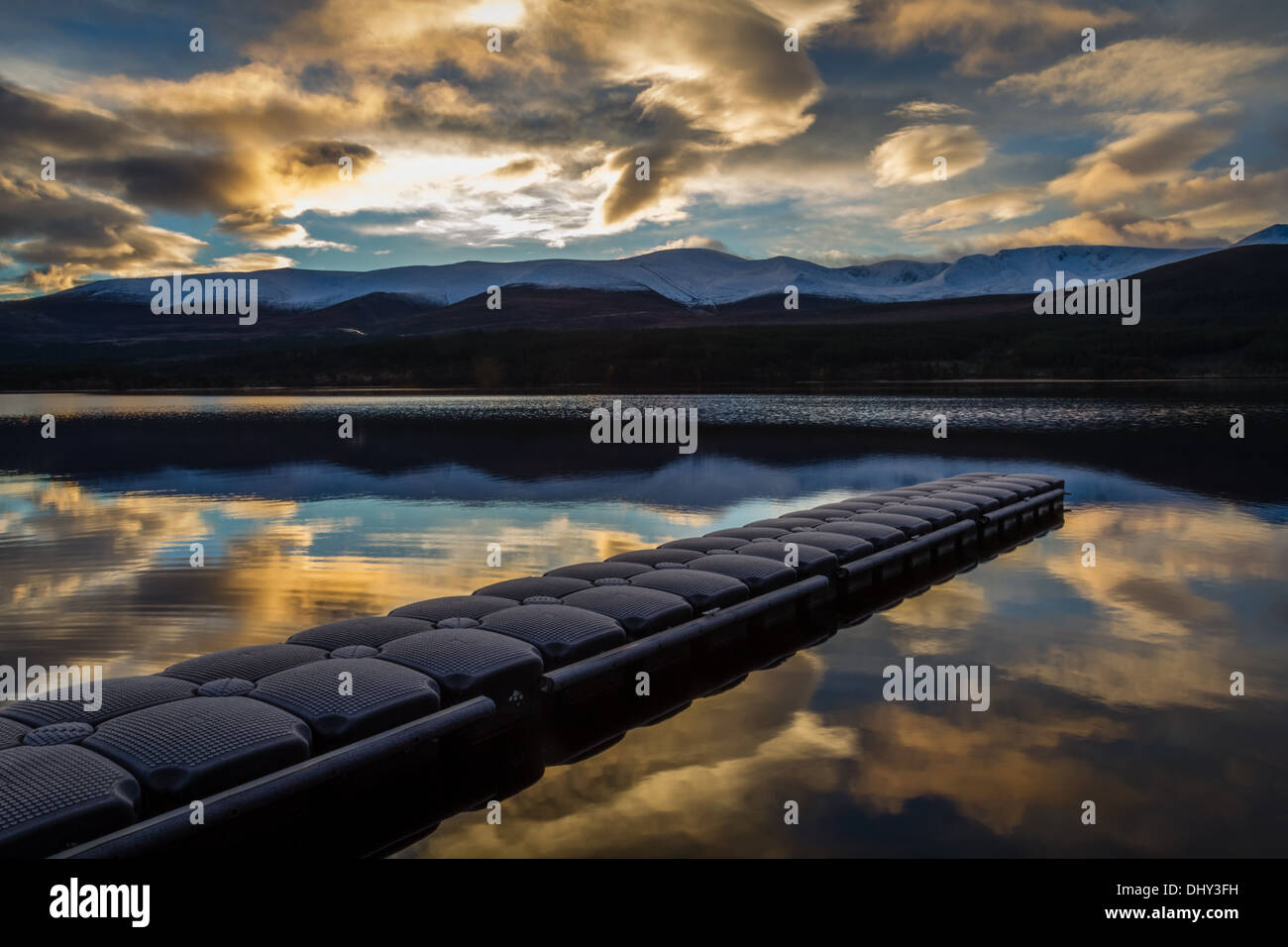 Stunning morning reflection with frosty jetty on Loch Morlich in the Cairngorms Stock Photo