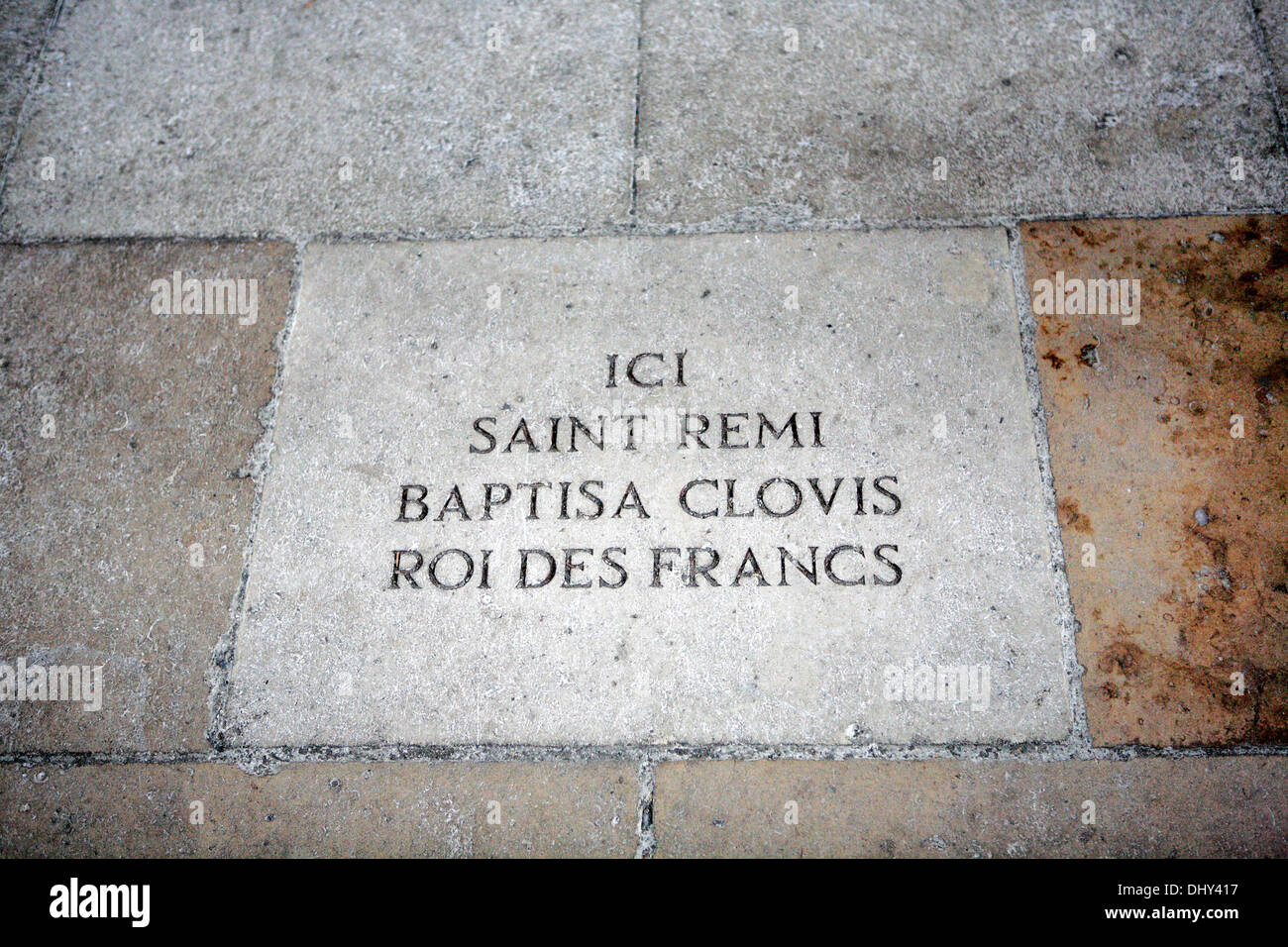 Paving stone in cathedral nave commemorating baptism of Clovis by Saint Remi, Reims cathedral, France Stock Photo