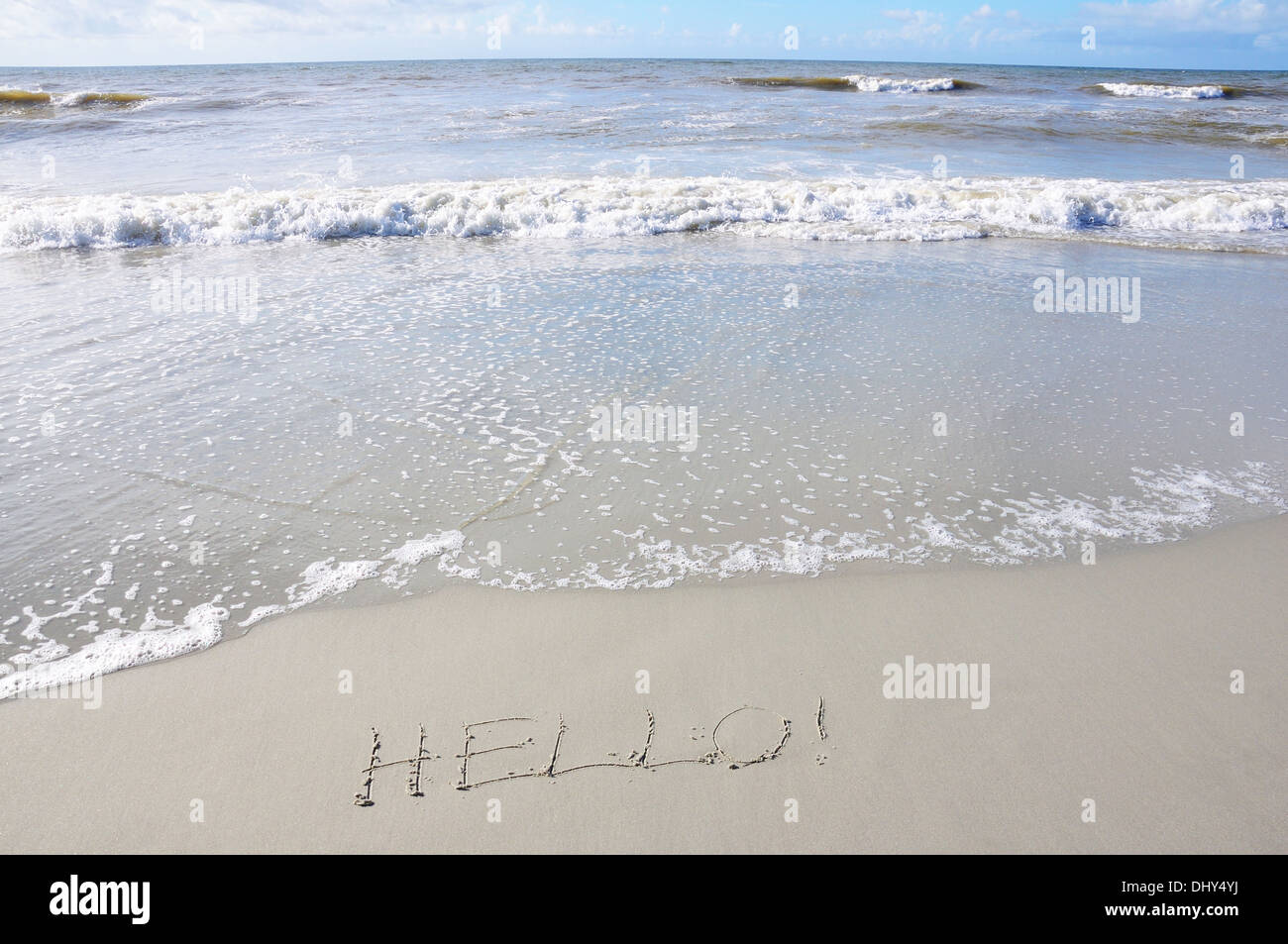 Seashore with HELLO! written on the sand Stock Photo