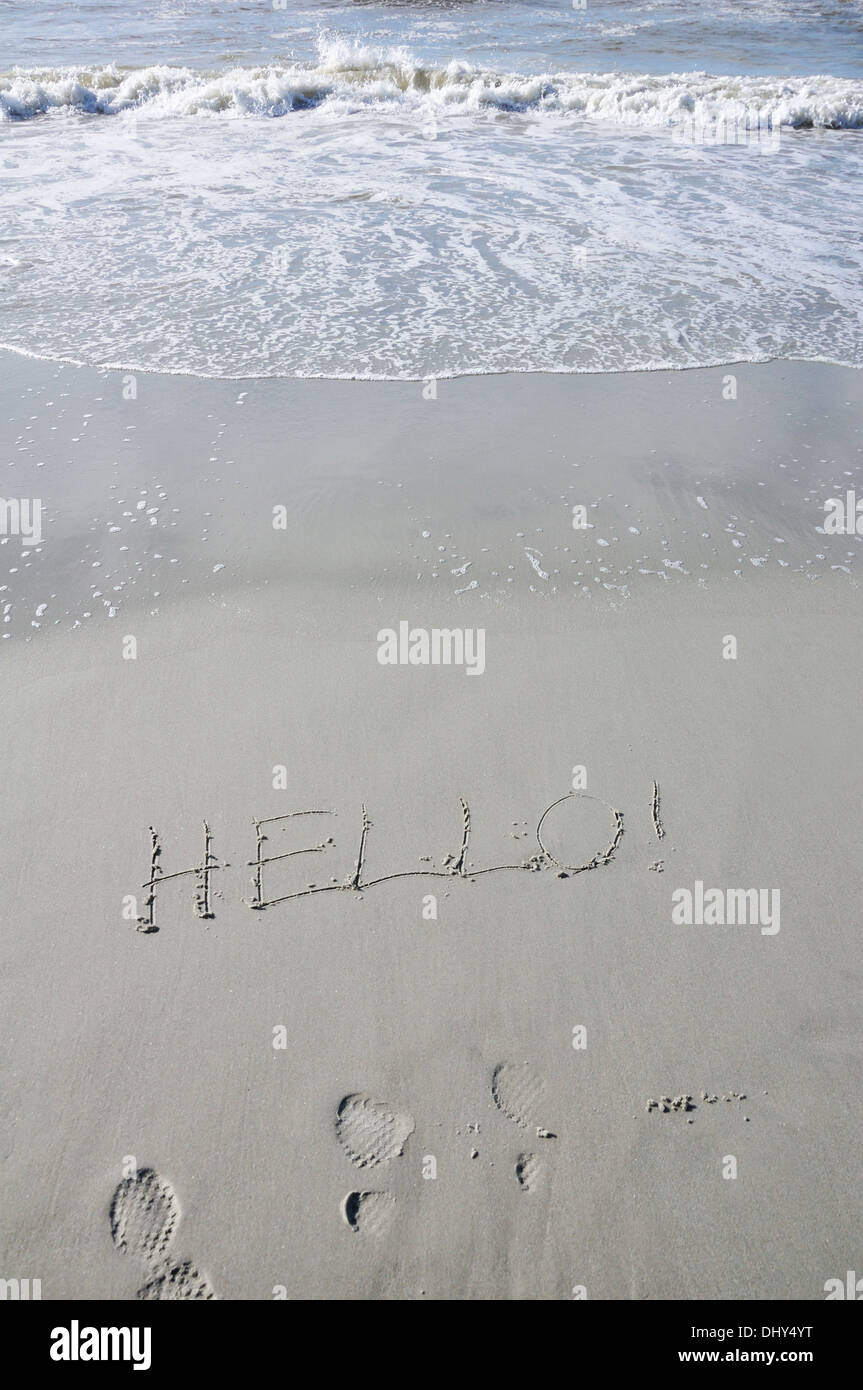 Seashore with HELLO! written on the sand Stock Photo