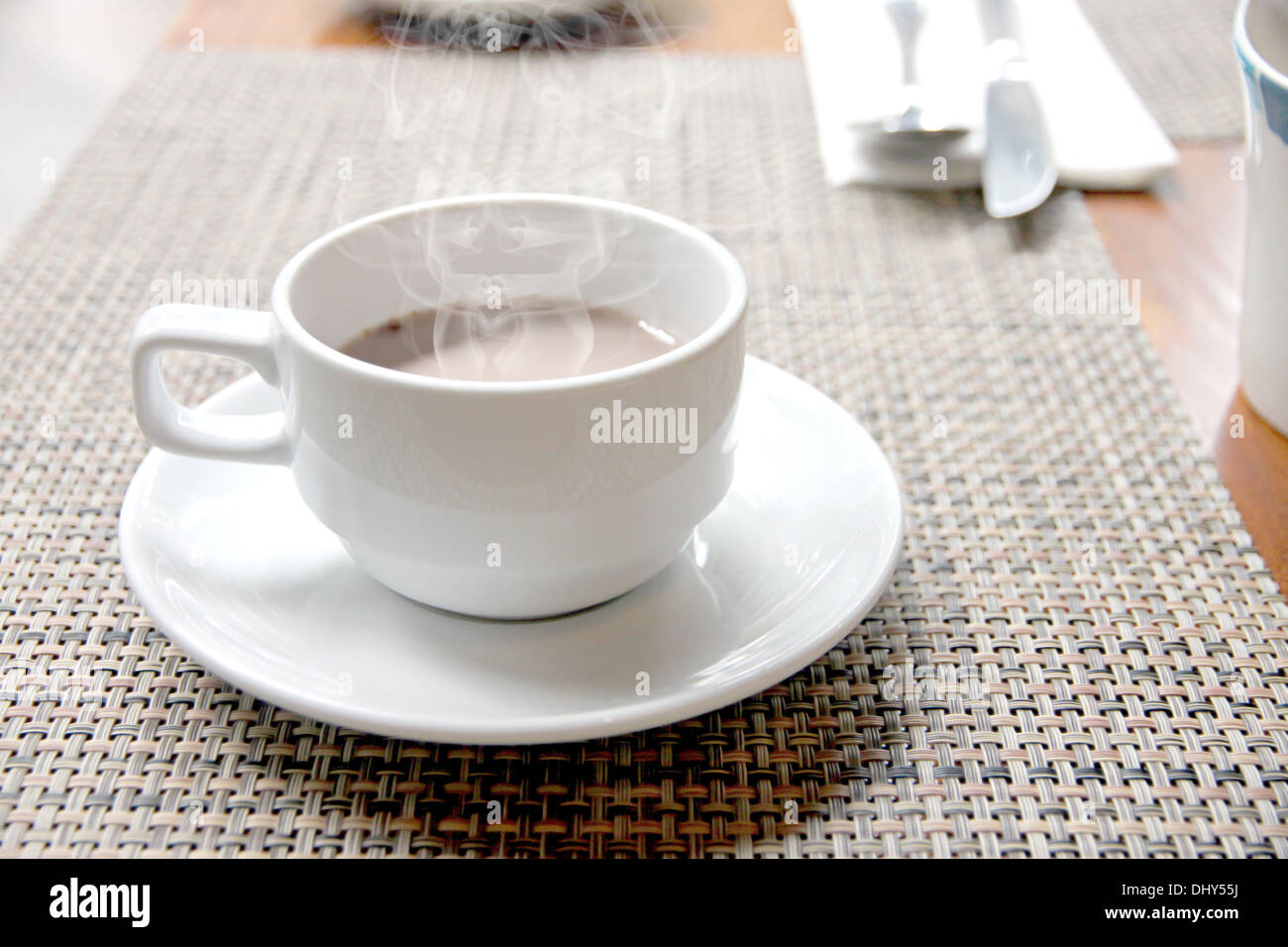 White cup of hot cocoa on the table. Stock Photo