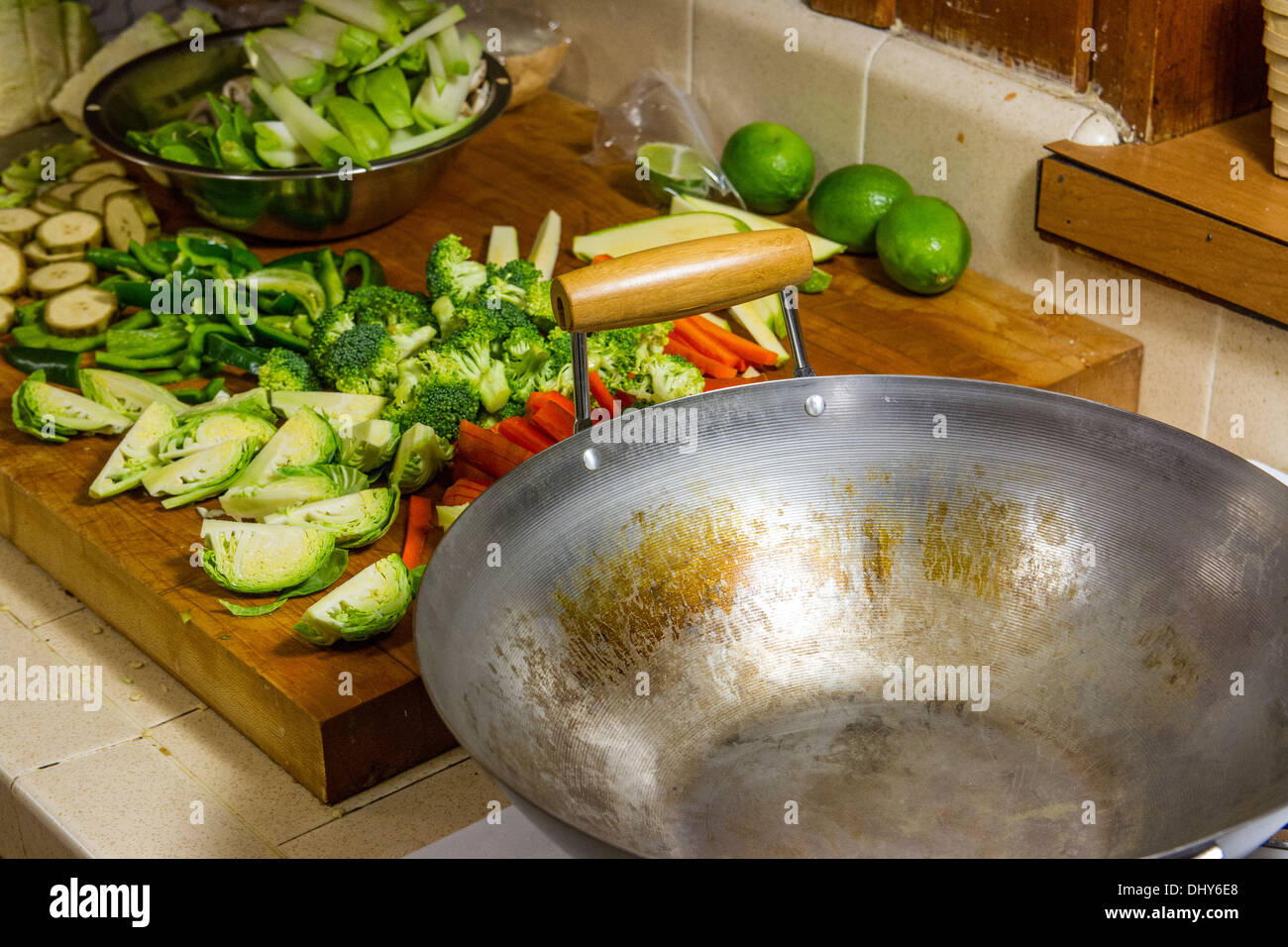 Broccoli sliced carrots Chayote Squash Plantain Brussel Sprouts in a Wok for a stir fry dinner Stock Photo