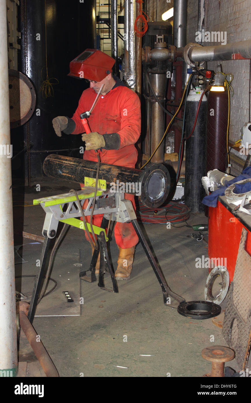 A welder wearing his full personal protection equipment, ppe Stock