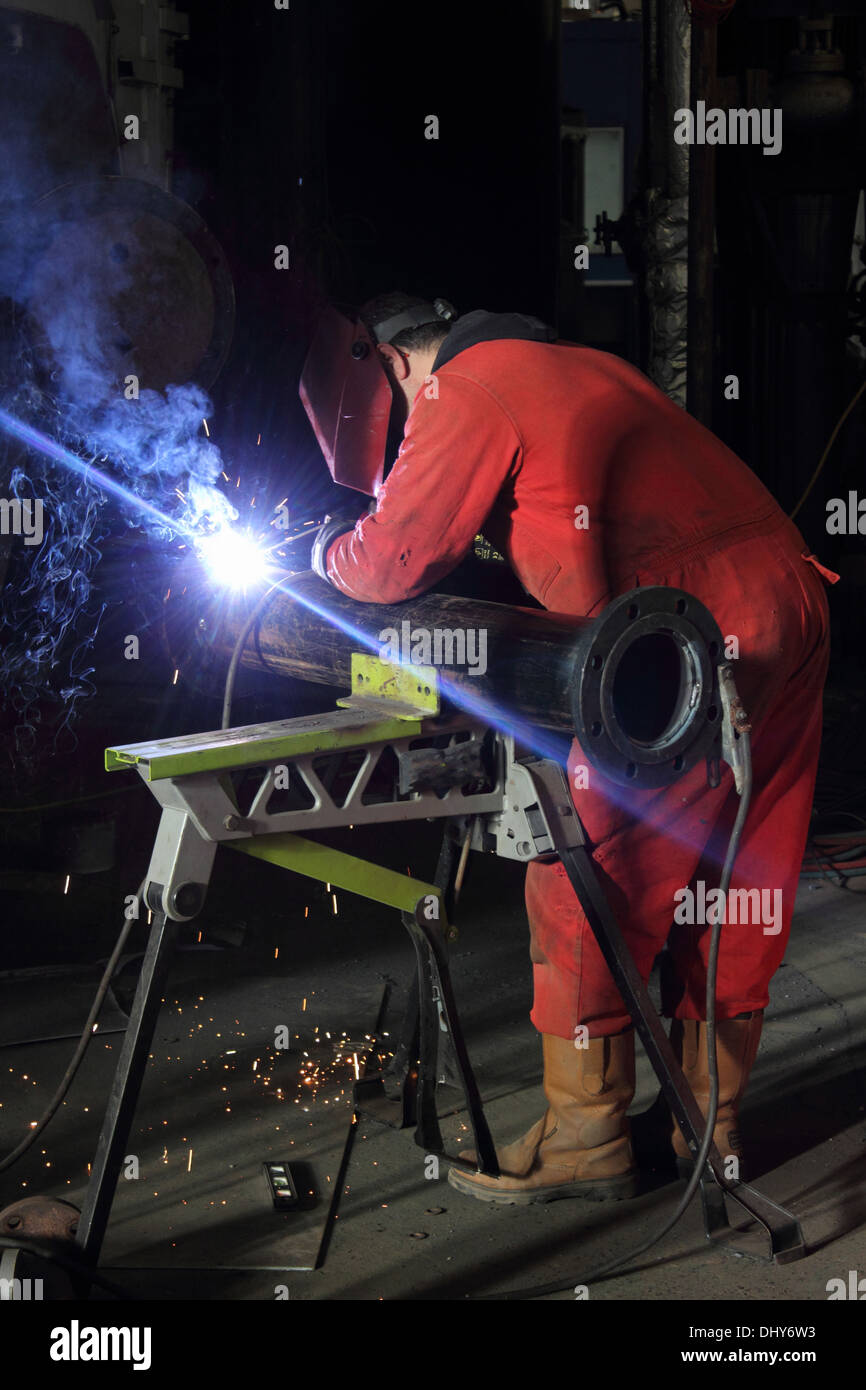 A welder wearing his full personal protection equipment, ppe Stock