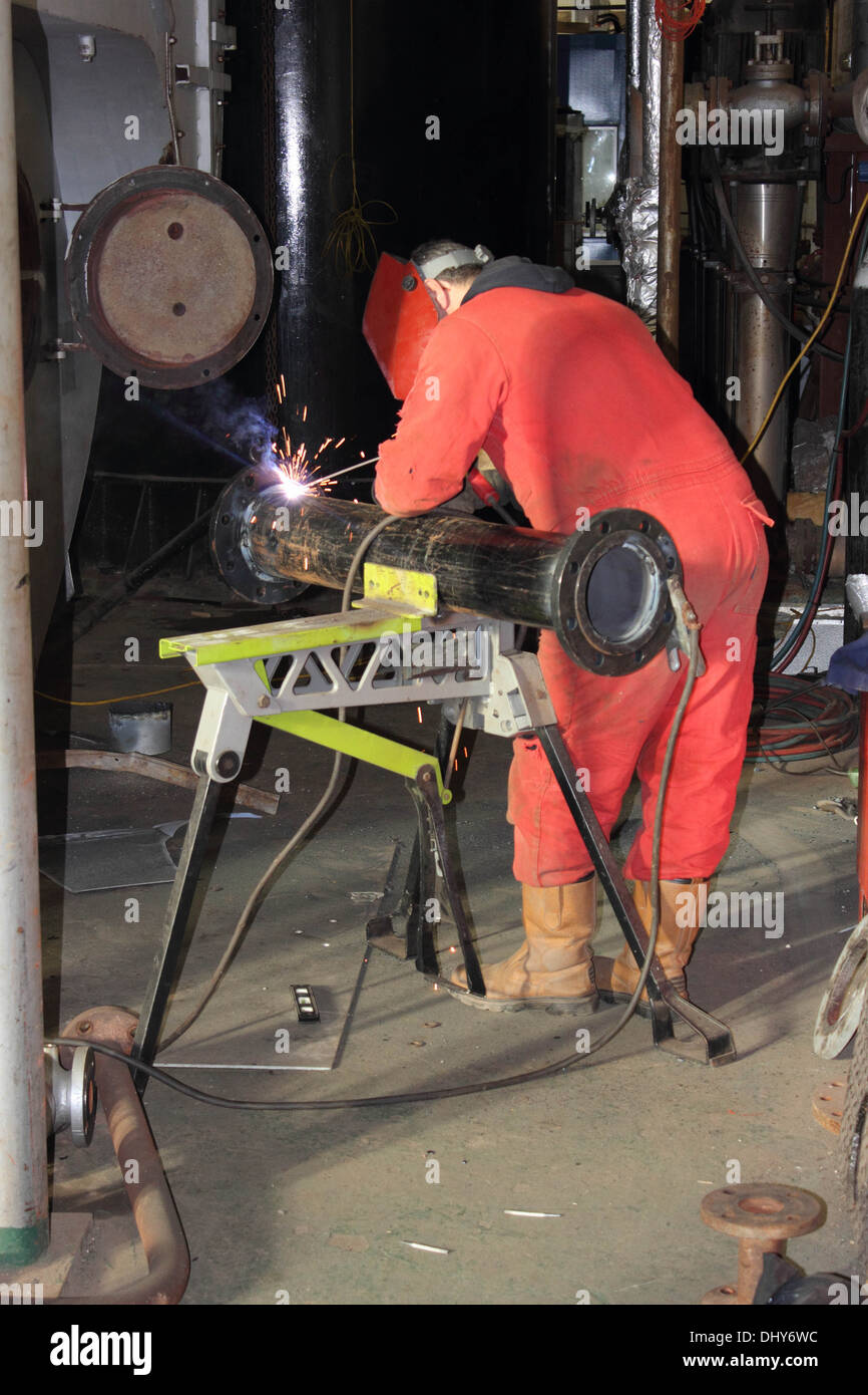 A welder wearing his full personal protection equipment, ppe Stock