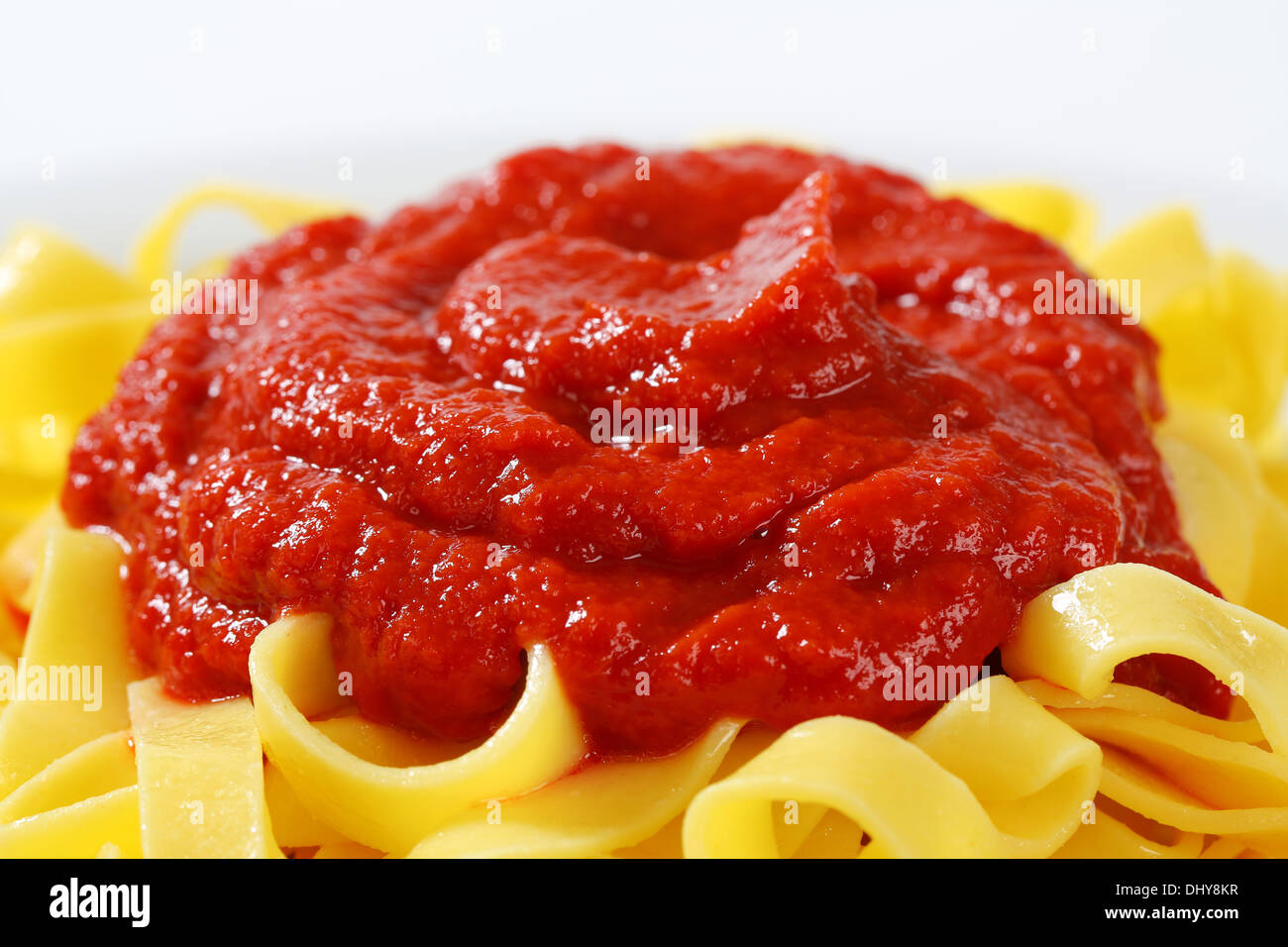 Thin ribbon pasta with tomato puree Stock Photo - Alamy