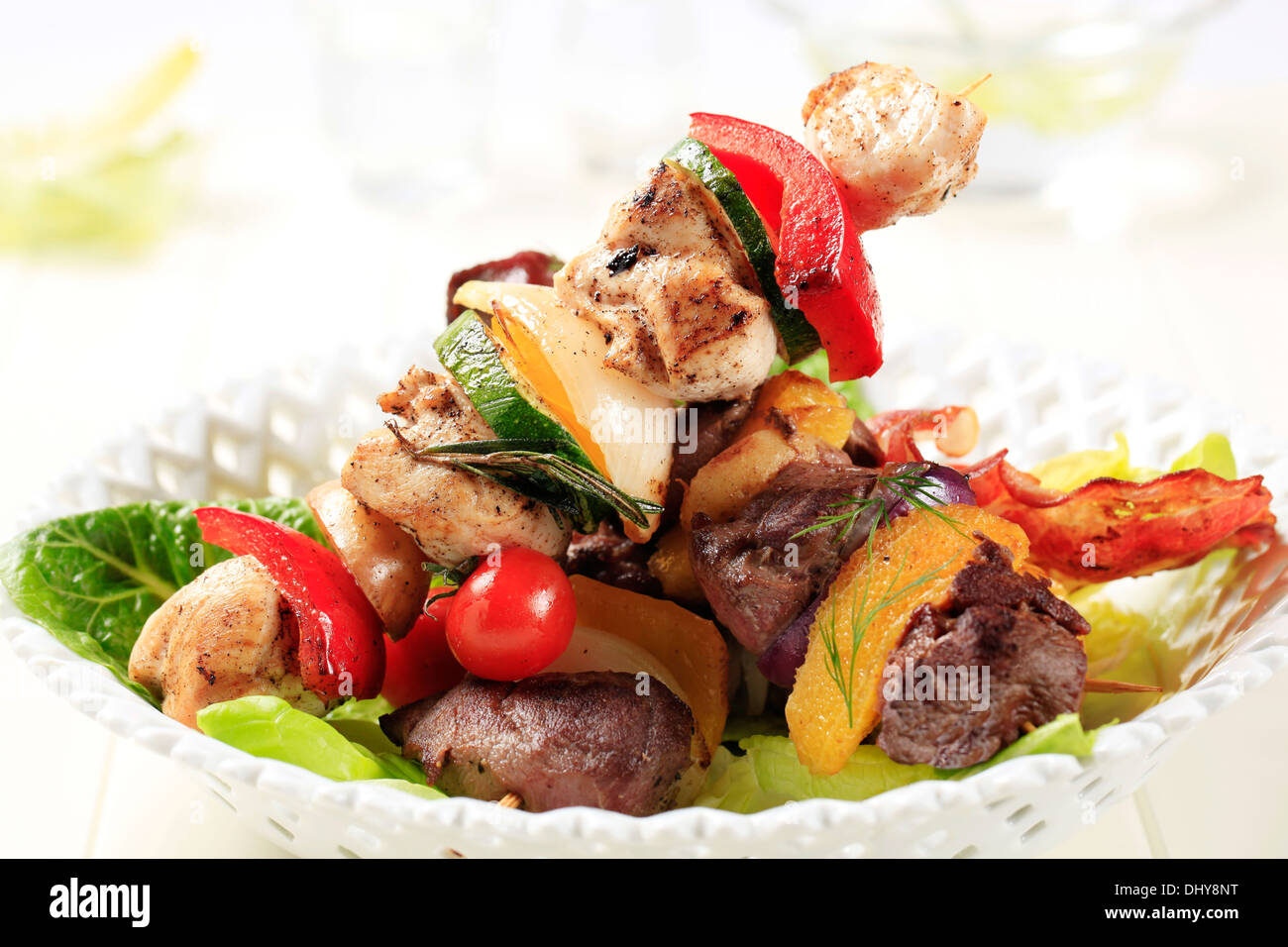 Grilled shish kebabs on lettuce leaves Stock Photo