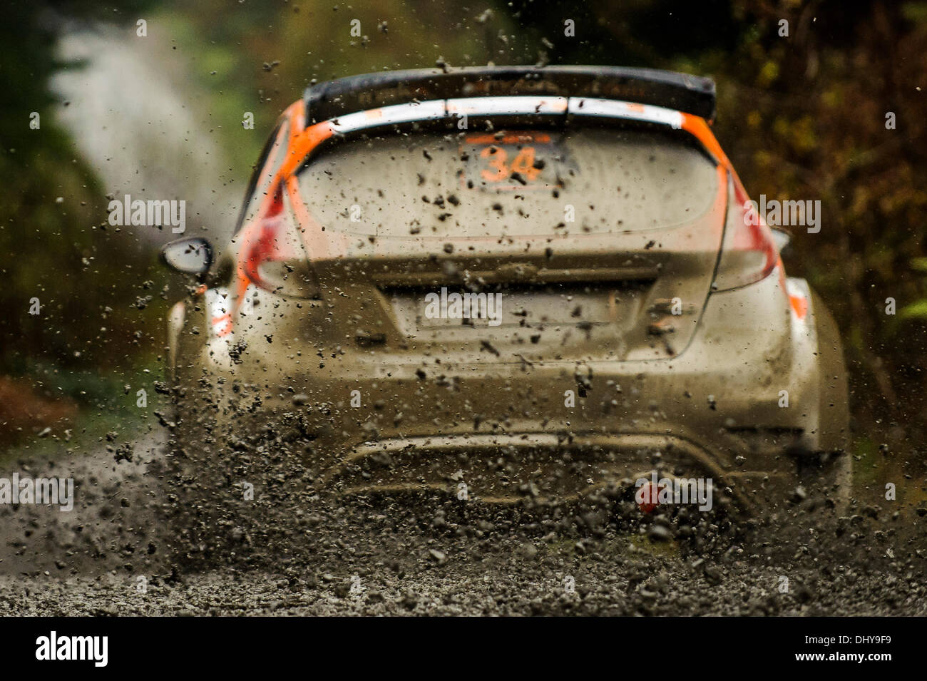 Powys, Wales. 16th Nov, 2013. Mud is thrown up as Mark Higgins and Carl ...