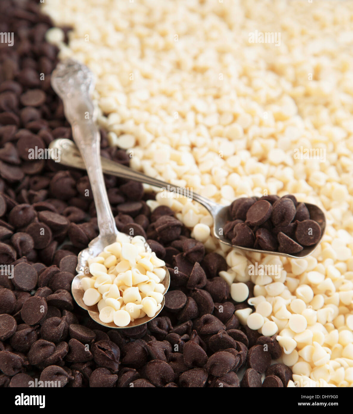 White and dark chocolate chips background. Baking ingredient Stock Photo