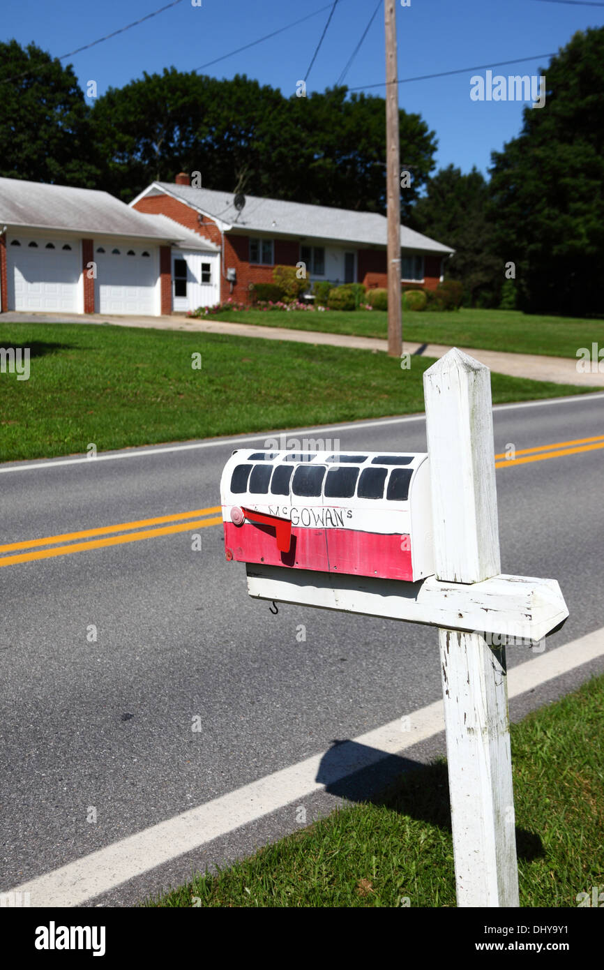 Painted wooden mailbox in design of a bus / coach in residential suburb, near Westminster, Carroll County, Maryland, USA Stock Photo