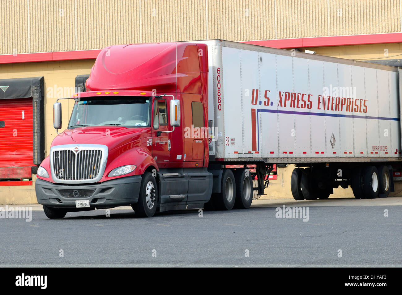 Truck lorry semi tractor trailer backed up to a loading dock Stock