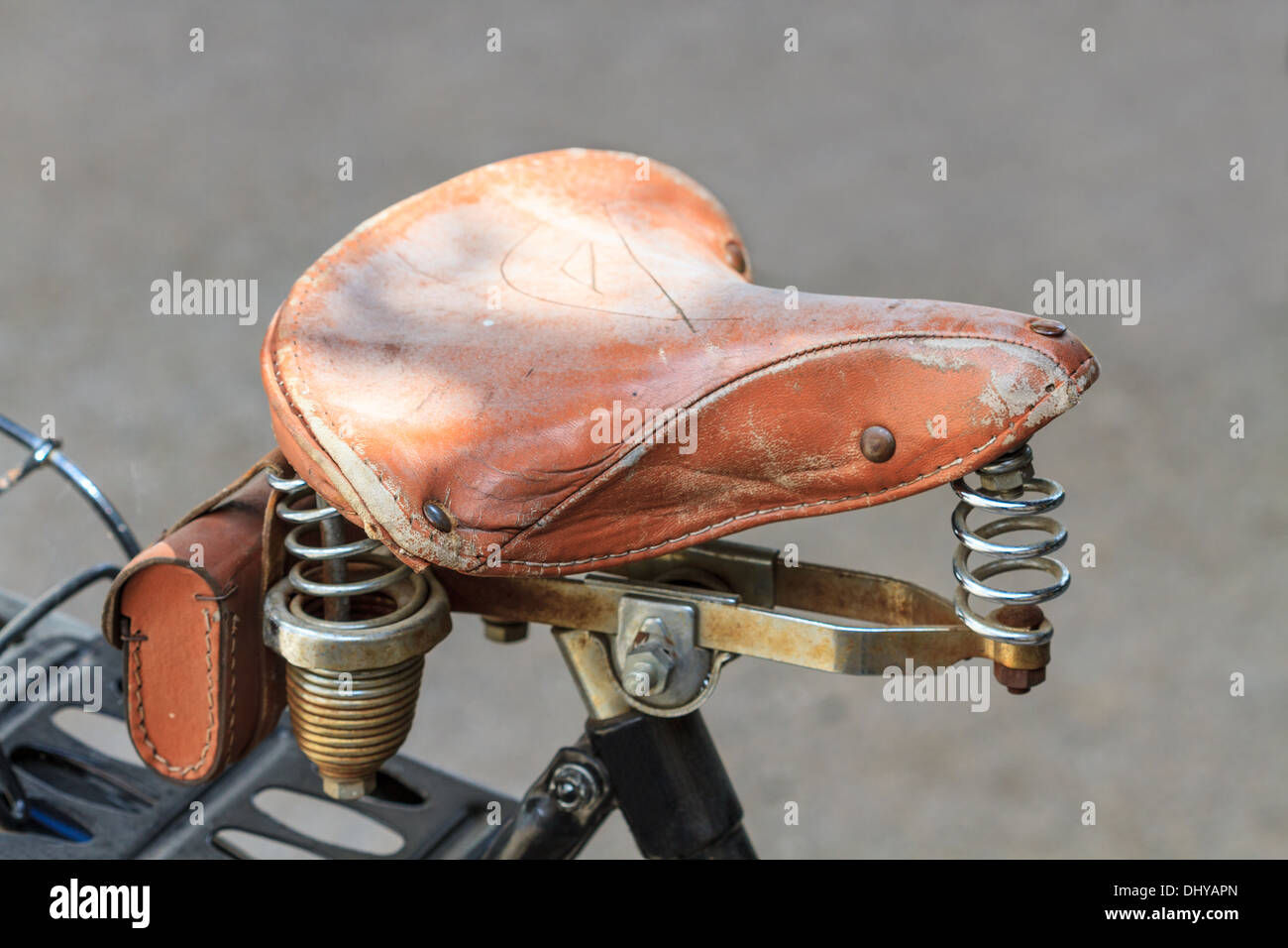Details of vintage leather bike saddle with metal springs Stock Photo Alamy
