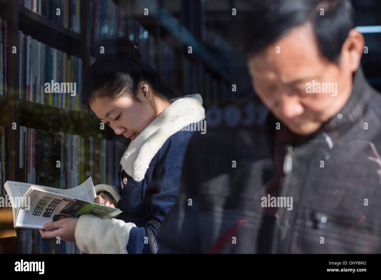 Beijing, China. 11th Nov, 2013. Reading in a book store at Qianmen ...
