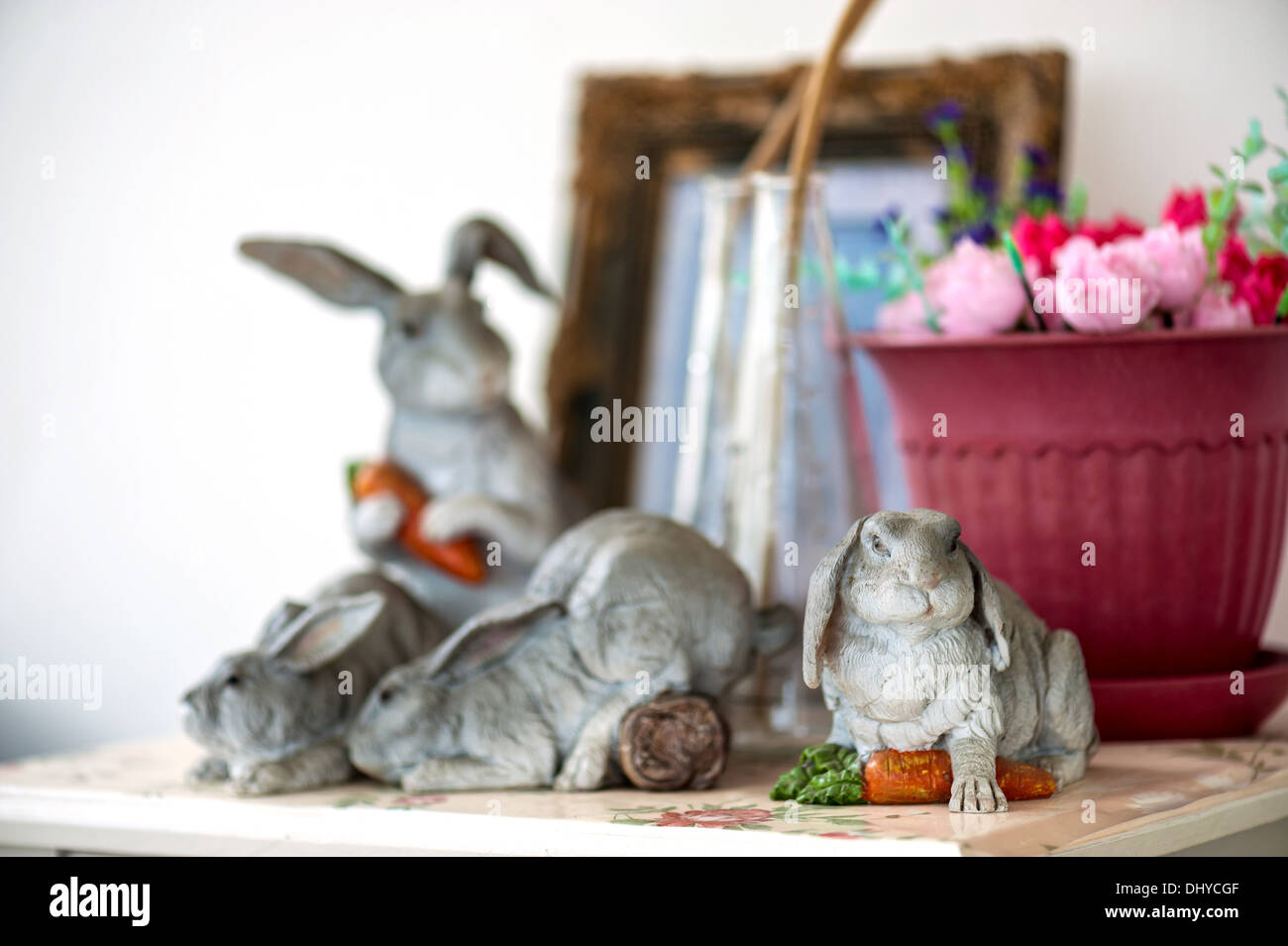 Concrete Rabbits in vintage room Stock Photo - Alamy
