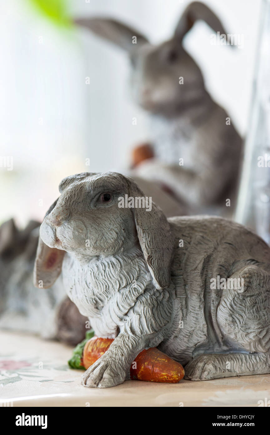 Concrete Rabbits in vintage room Stock Photo - Alamy