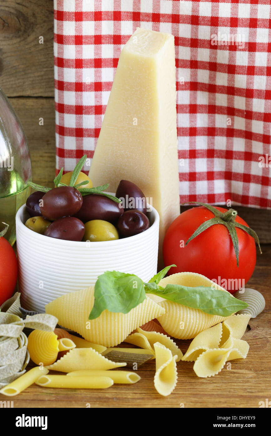 still life of Italian foods ( olive, oil, pasta, cheese ) Stock Photo