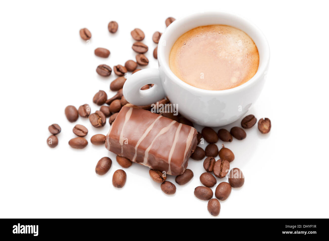 Small espresso cup with chocolate and coffee beans isolated on white Stock Photo
