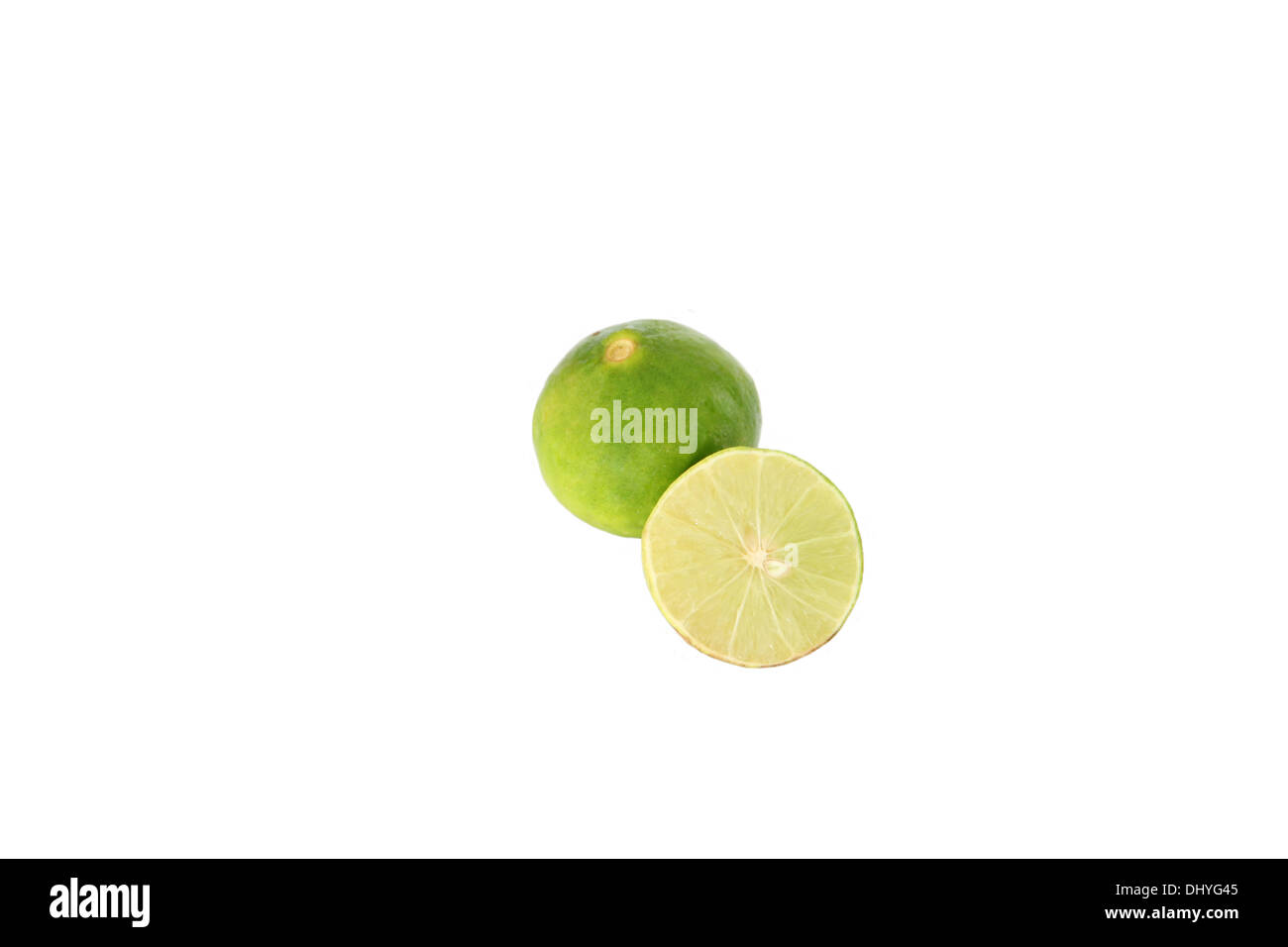 The Green lemon and slice on white background Stock Photo - Alamy