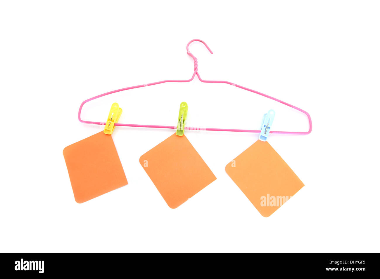 The Note paper and hanger on the white background. Stock Photo