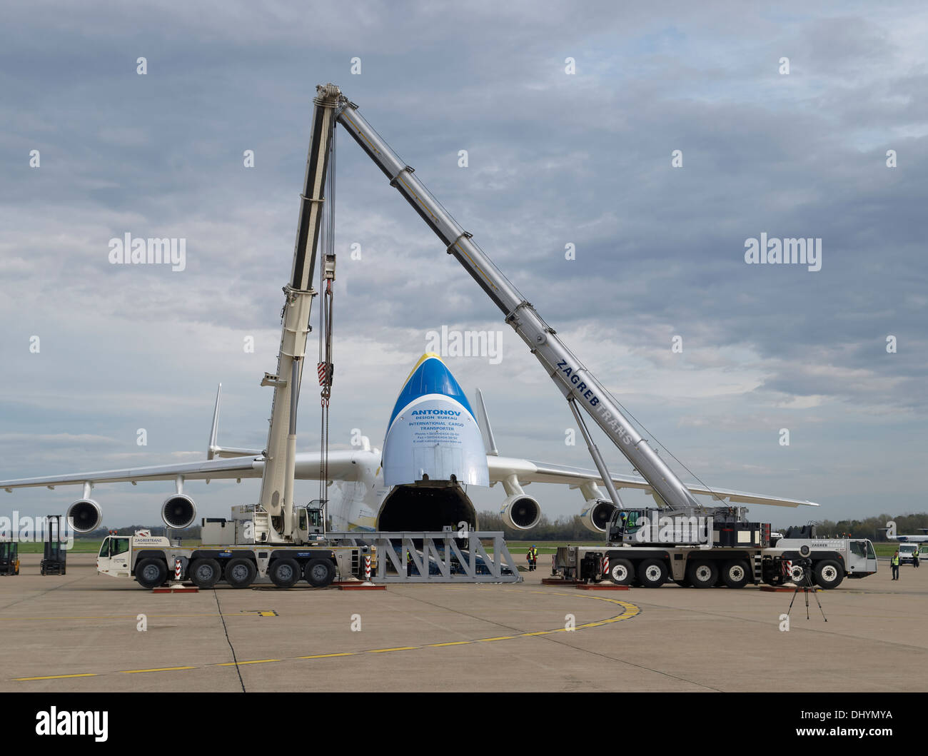 Almost full view of Antonov An-225 during loading session on the Pleso, Zagreb airport, Croatia. Cranes and heavy cargo is seen. Stock Photo