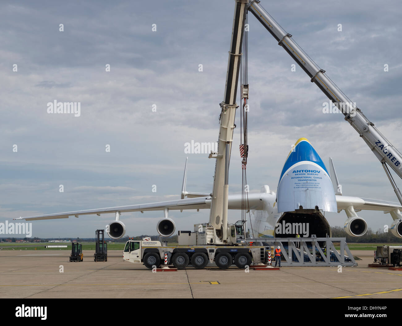 Partial view of Antonov An-225 during loading session on the Pleso, Zagreb airport, Croatia. Cranes and heavy cargo is seen. Stock Photo