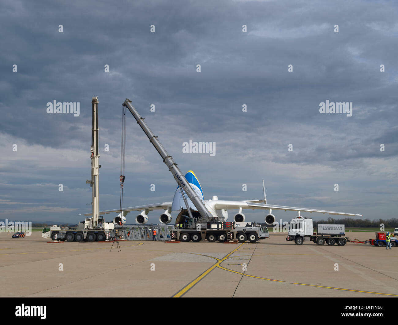 Full view of Antonov An-225 Mriya during loading session on the Pleso, Zagreb airport, Croatia. Cranes and heavy cargo is seen. Stock Photo