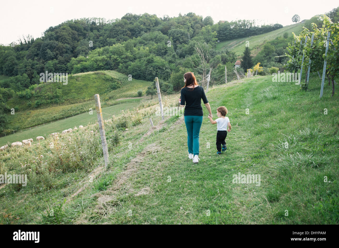 Mother and her son walking in the countryside Stock Photo