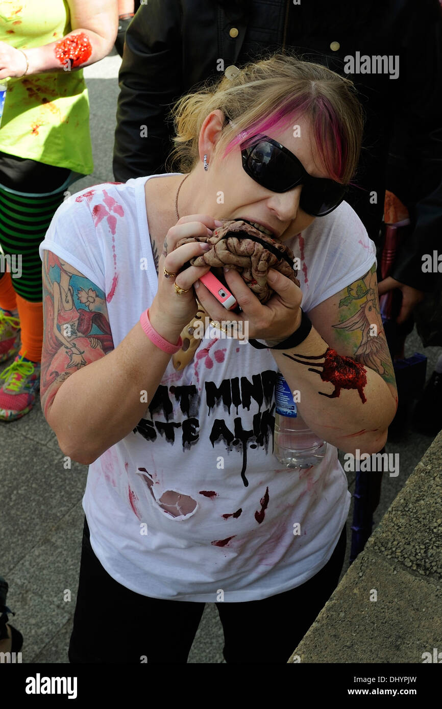 Zombie eating human brains in the inaugural Zombie Walk, Perth, Western Australia Stock Photo