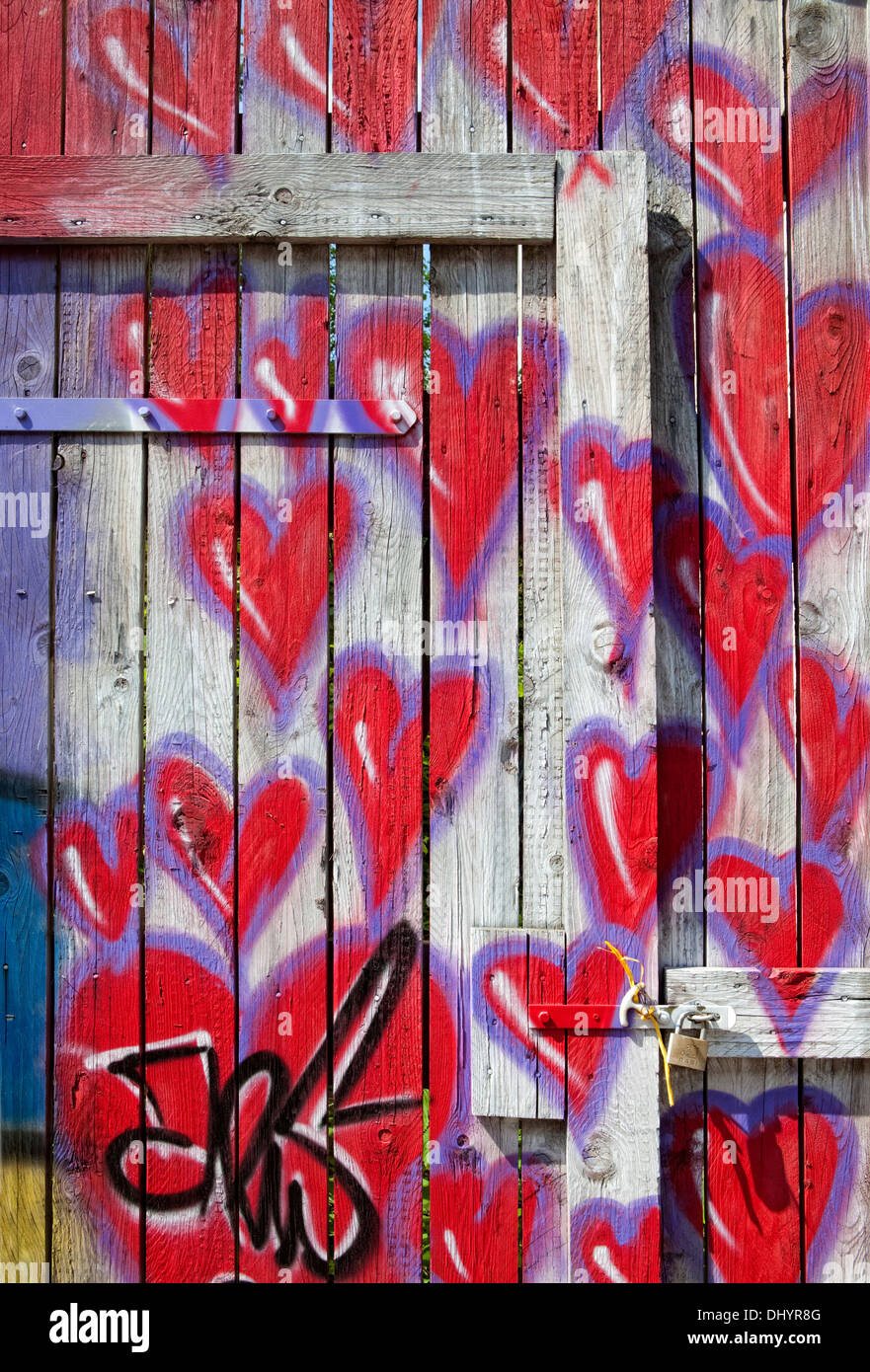 Red hearts painted on a fence, graffiti, Germany, Europe Stock Photo