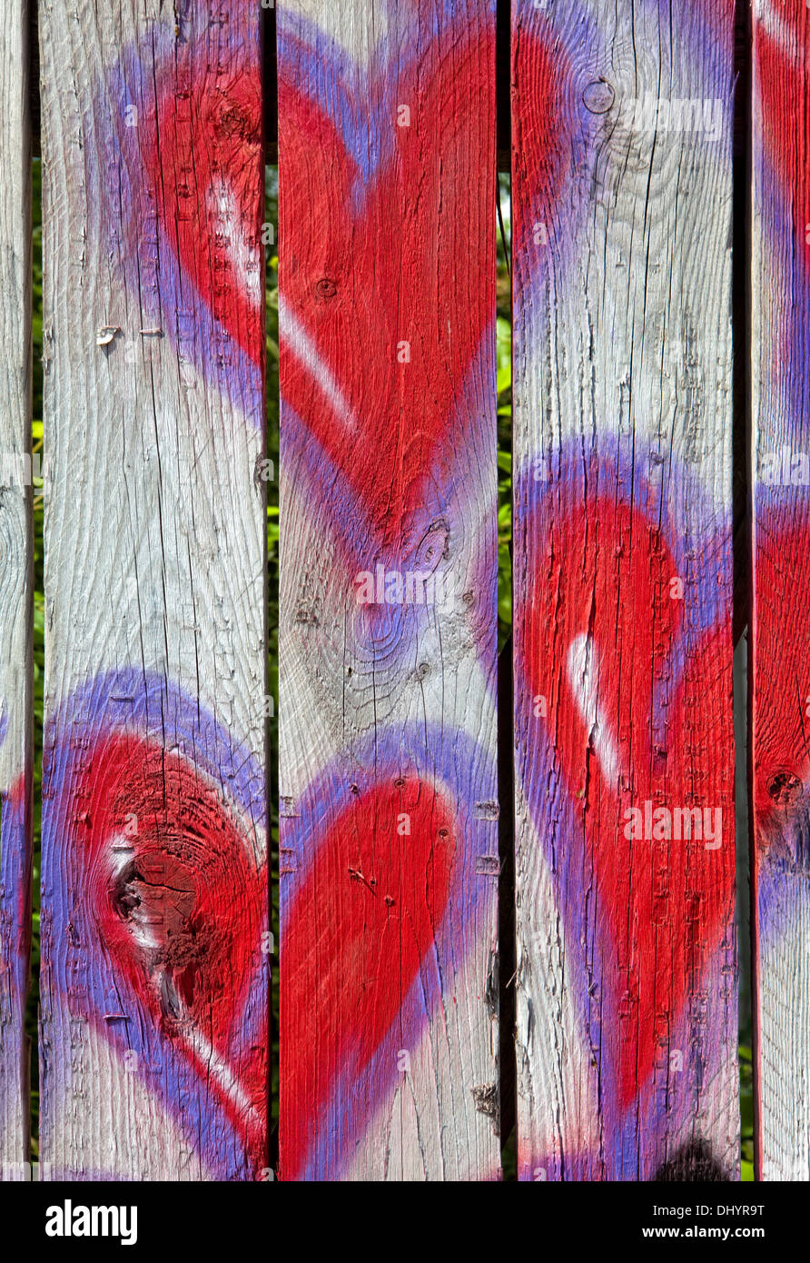 Red hearts painted on a fence, graffiti, Germany, Europe Stock Photo